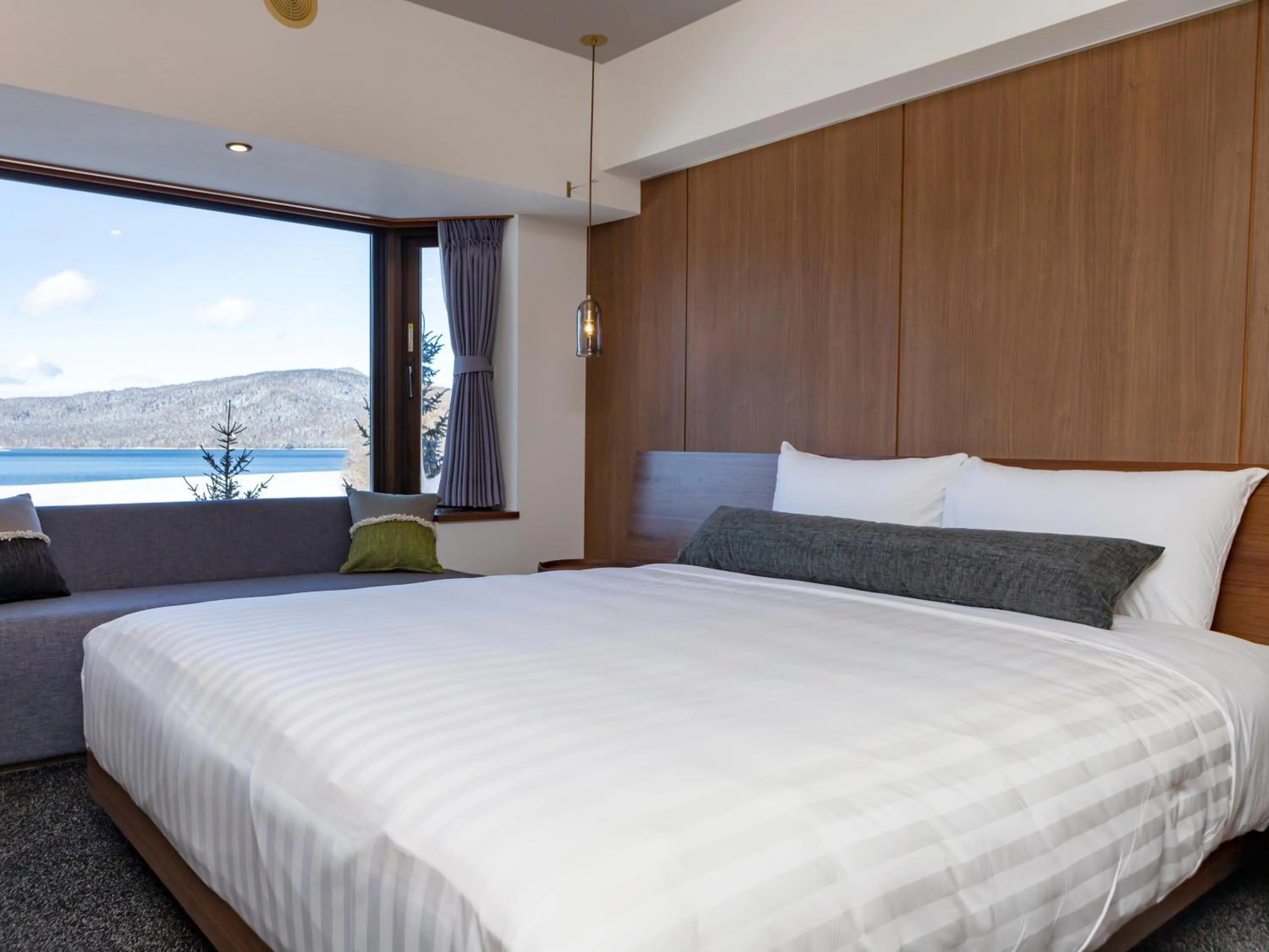 Bed in THE FOREST AKAN Tsuruga Resort