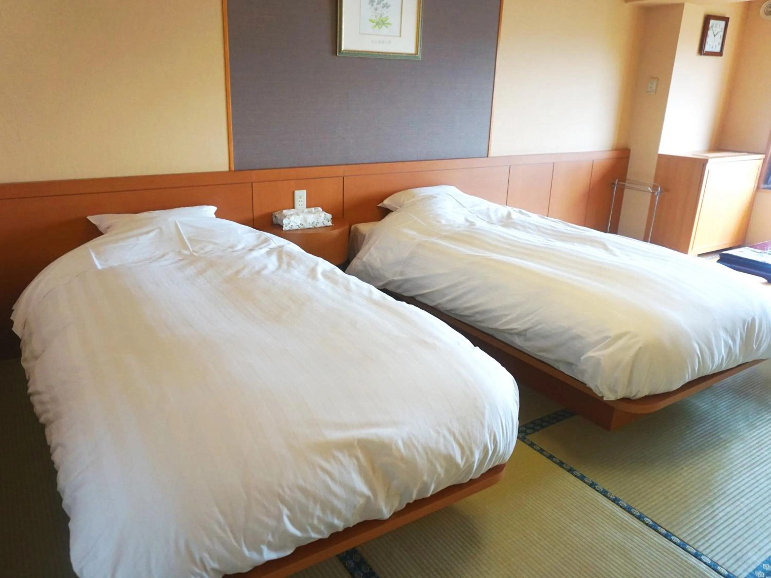 Bed in THE FOREST AKAN Tsuruga Resort