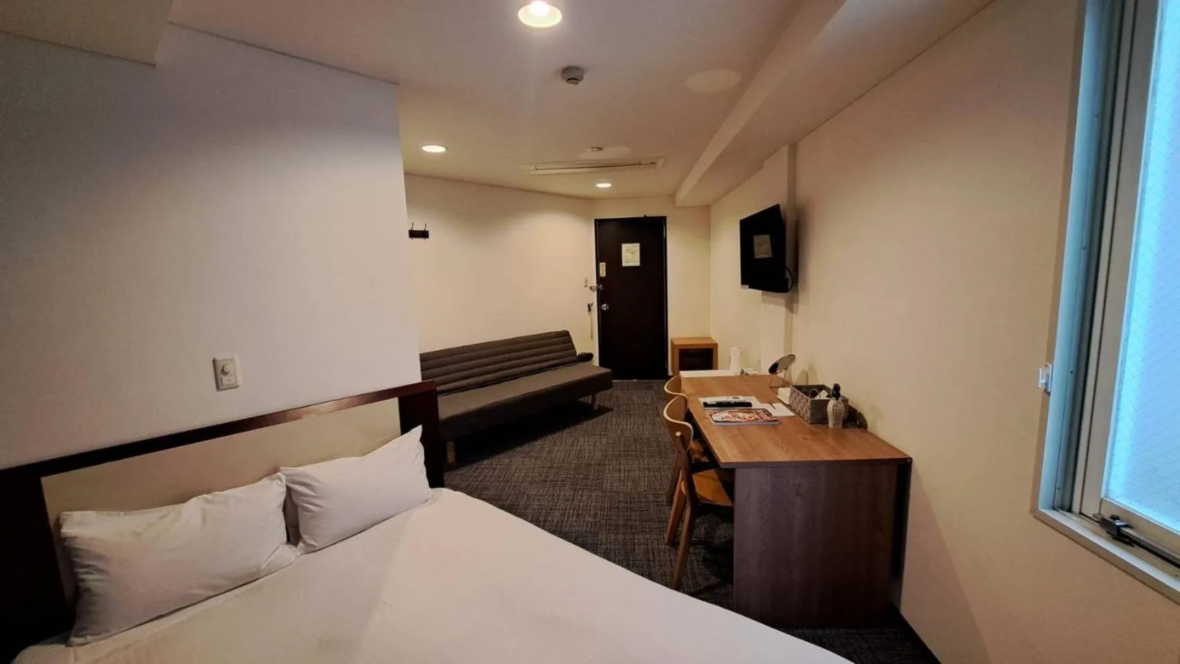 Photo of the whole room, Bed in Grampus Inn Osaka Namba