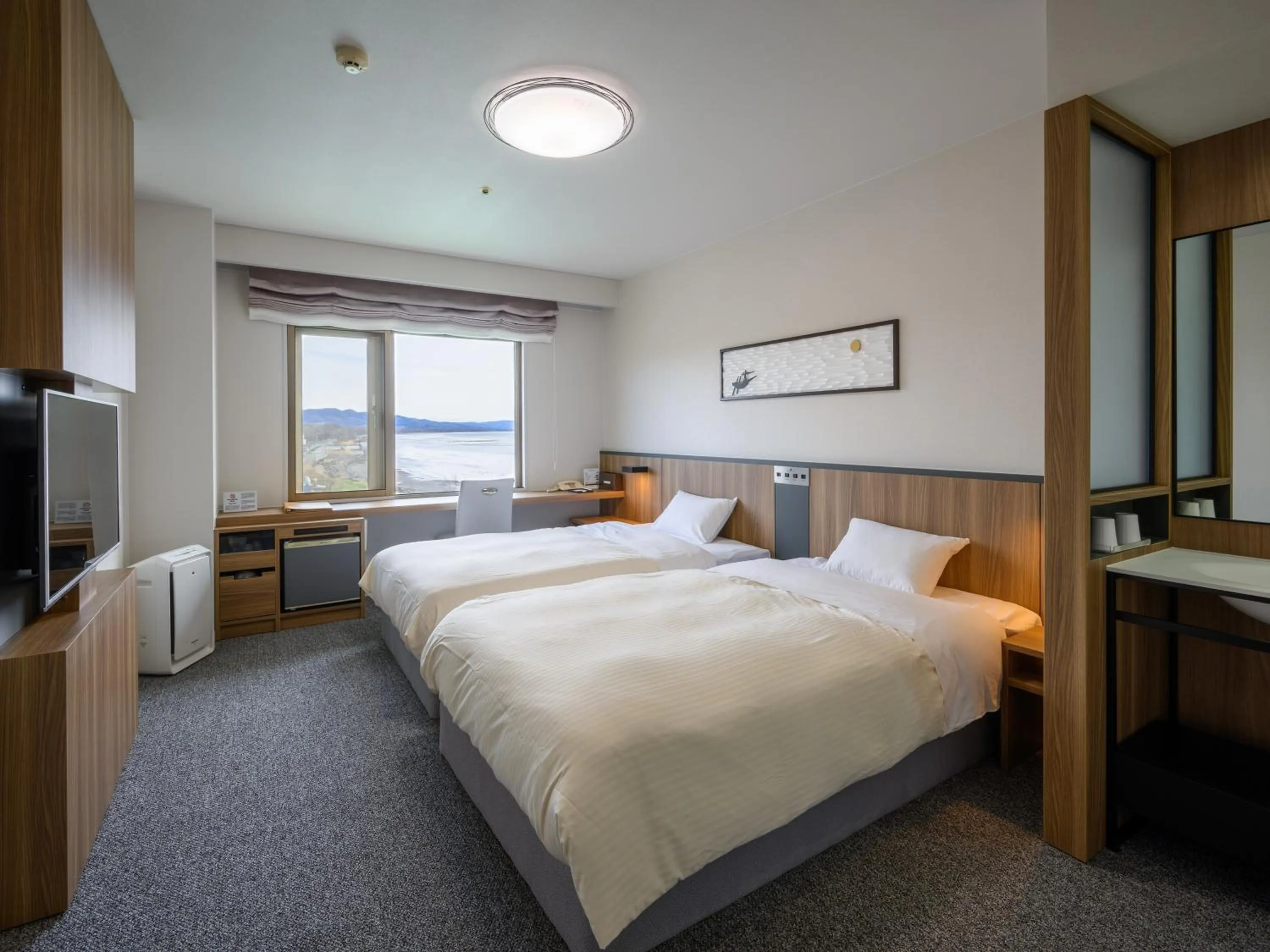 Photo of the whole room, Bed in Lake Saroma Tsuruga Resort