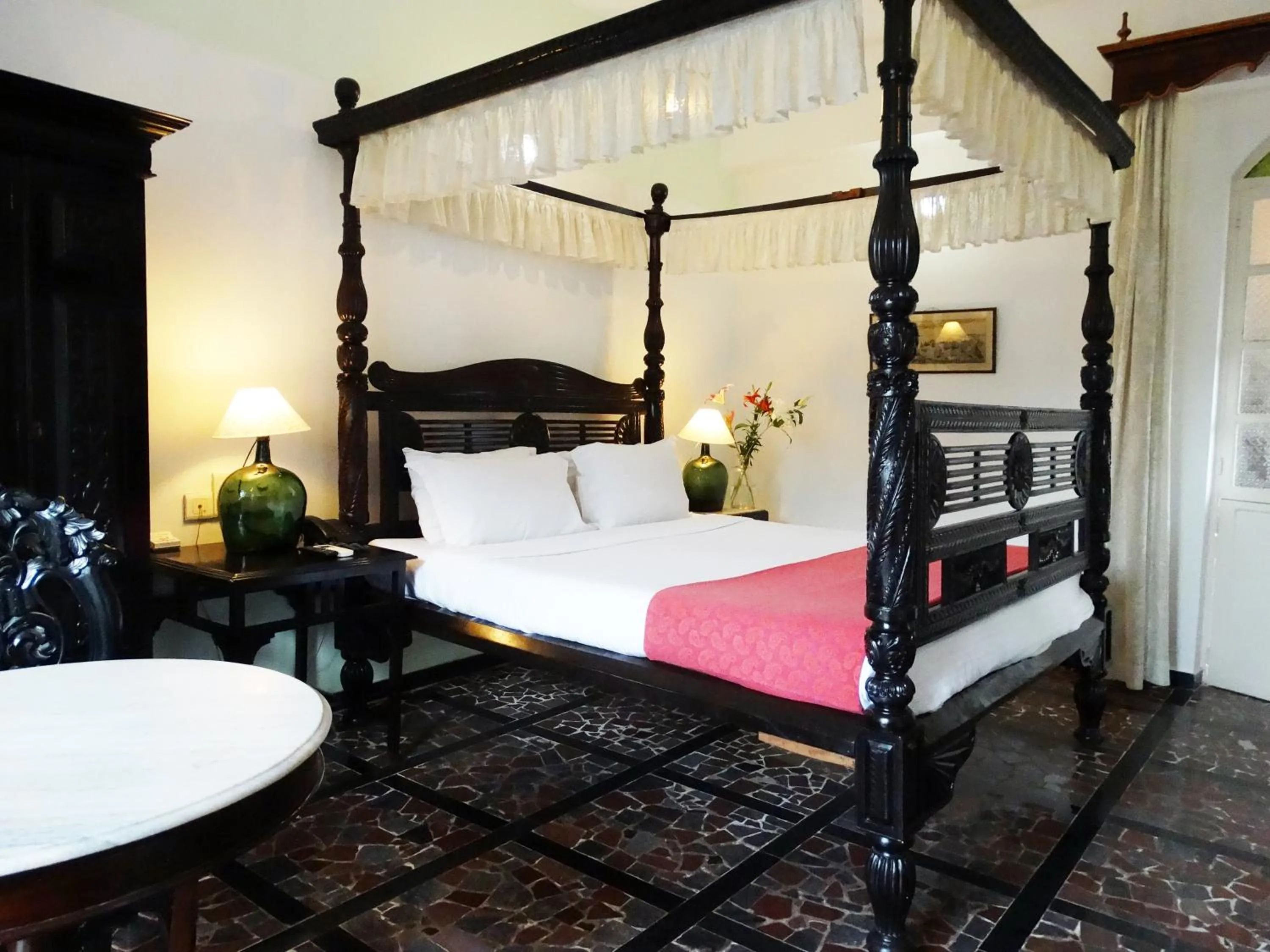 Bed in WelcomHeritage Panjim Inn