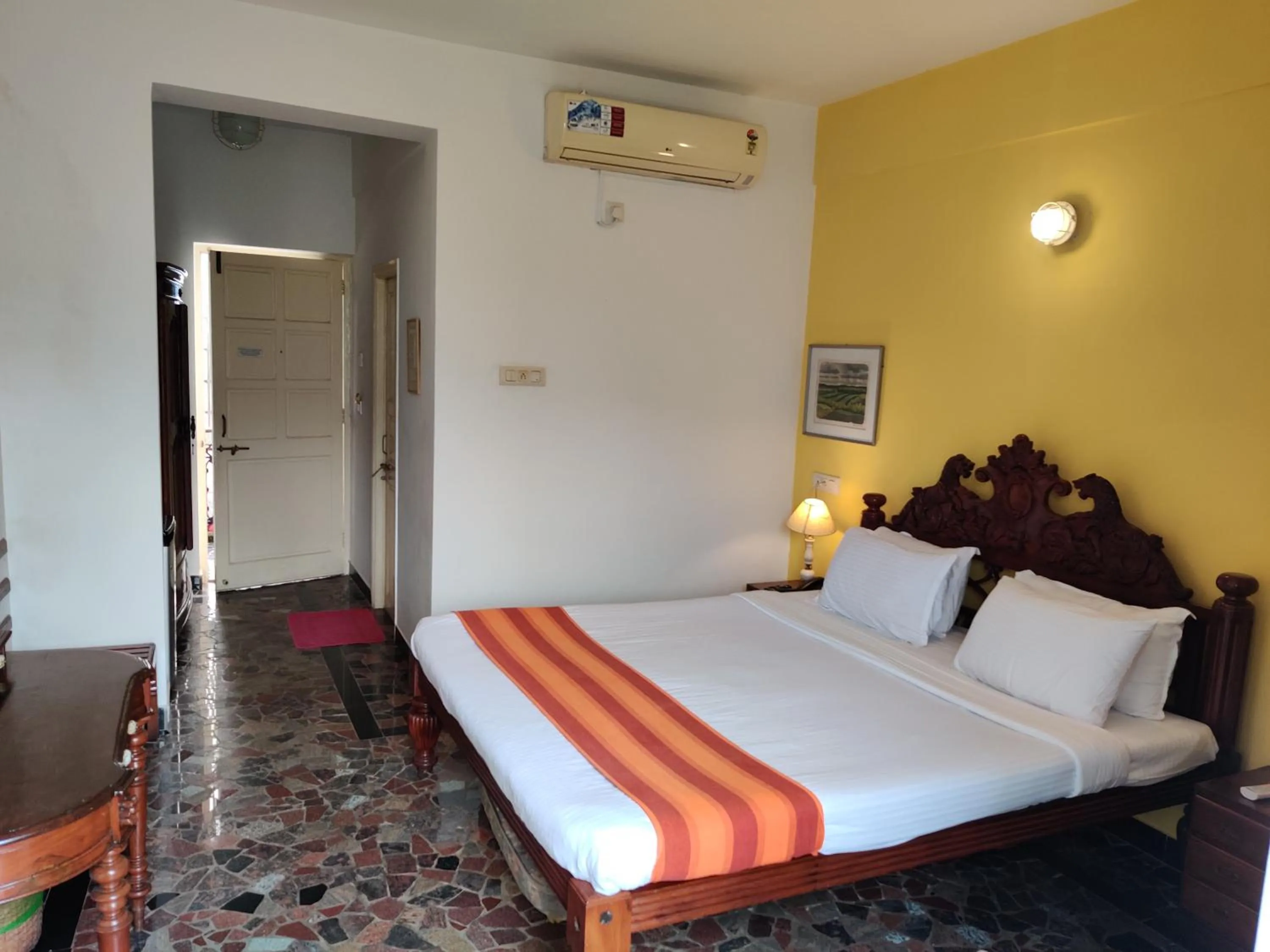 Bed in WelcomHeritage Panjim Inn