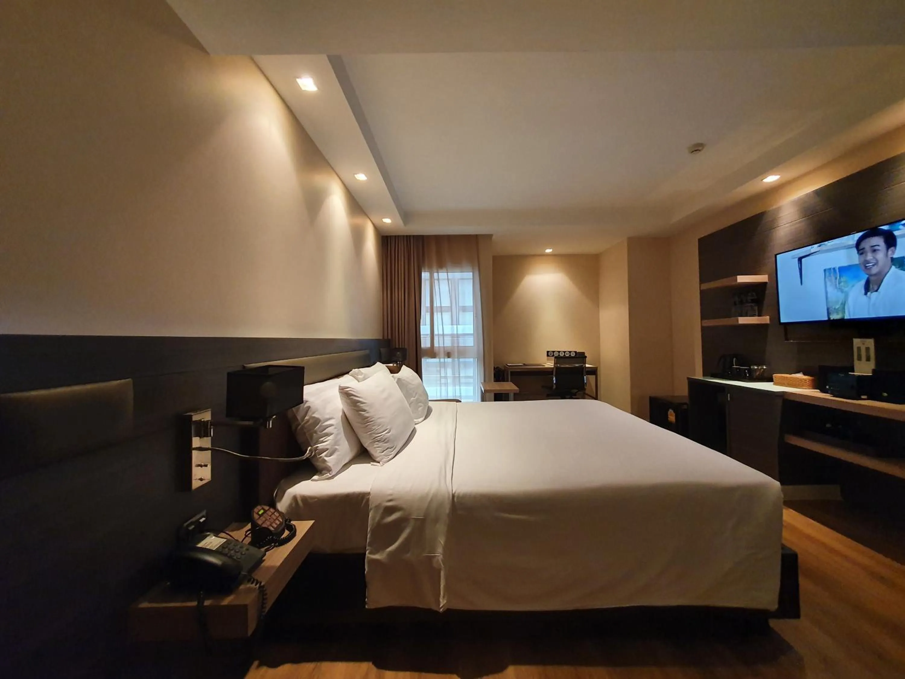 Bed in Amora NeoLuxe Suites Hotel