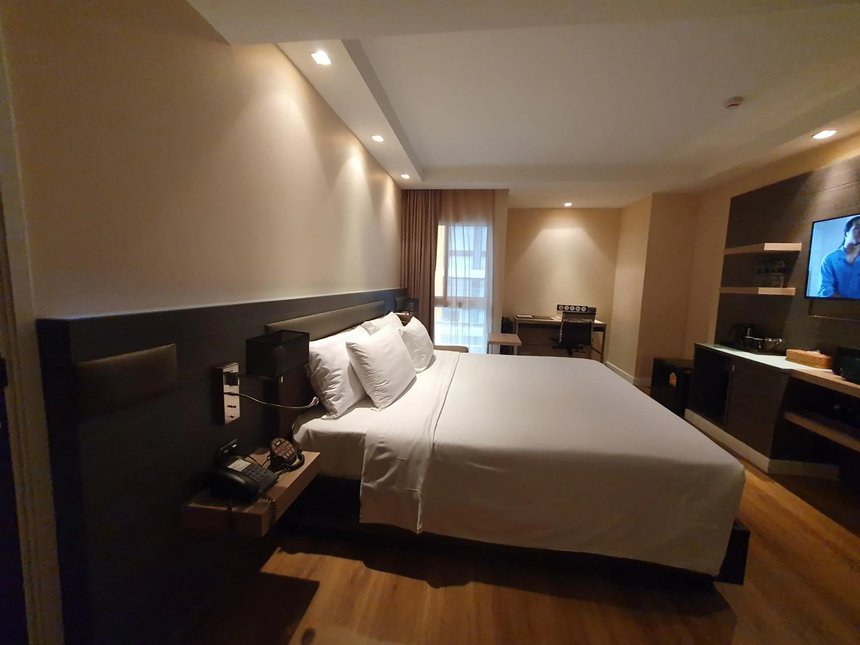 Bed in Amora NeoLuxe Suites Hotel