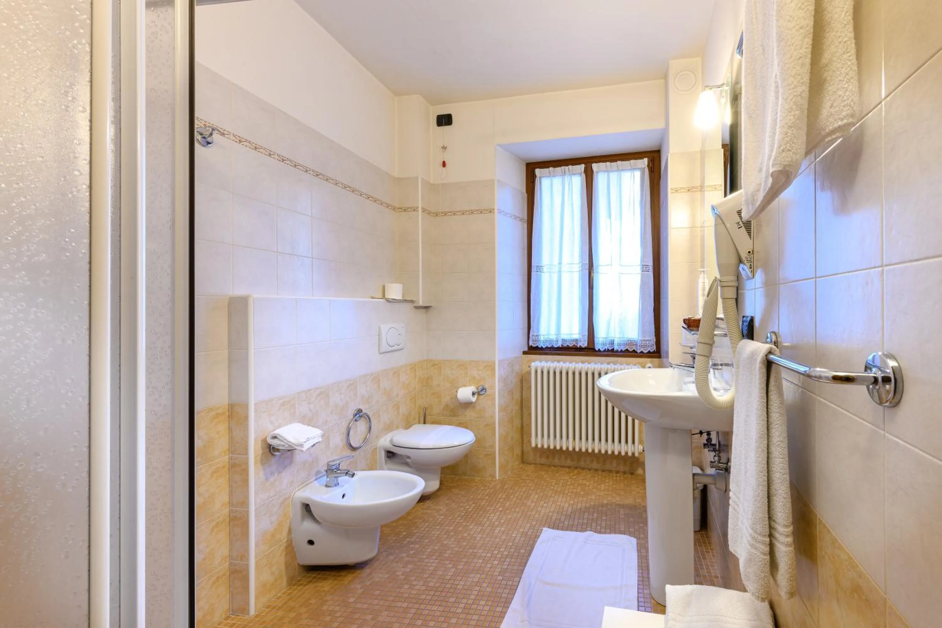 Bathroom in Hotel Garni Le Corti