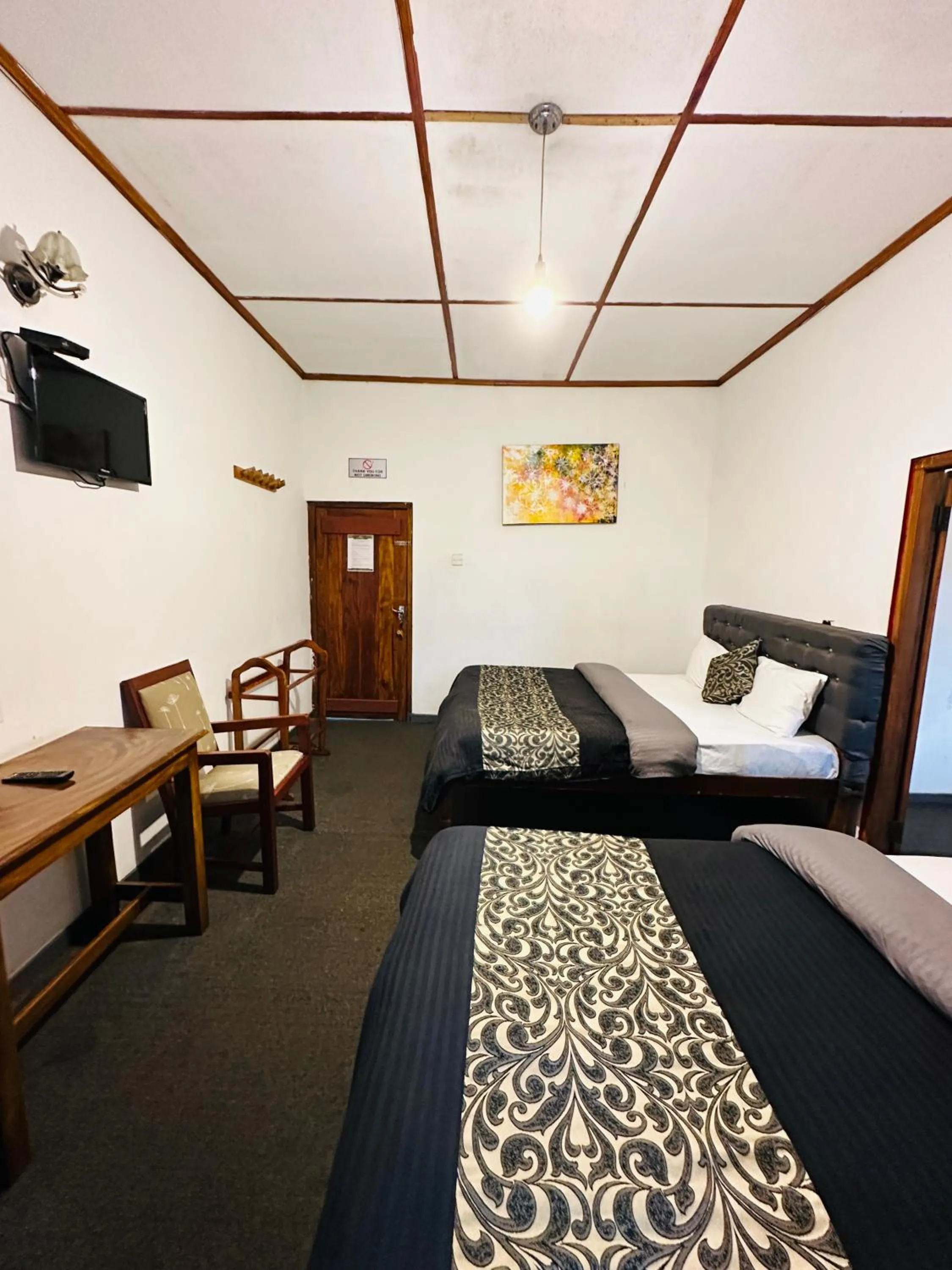 Bed in New Royal Mount Hotel