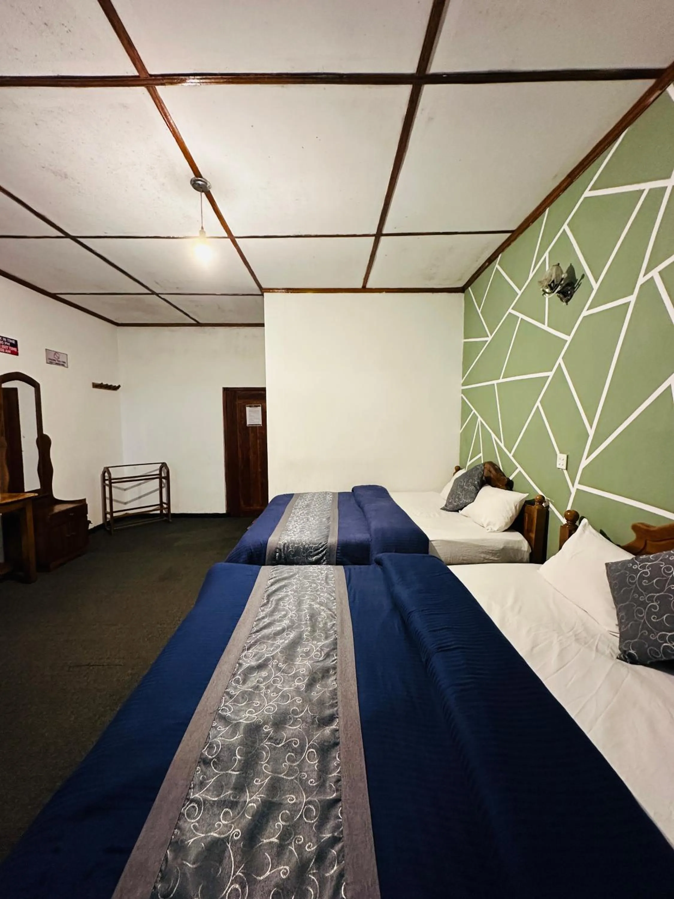 Bed in New Royal Mount Hotel