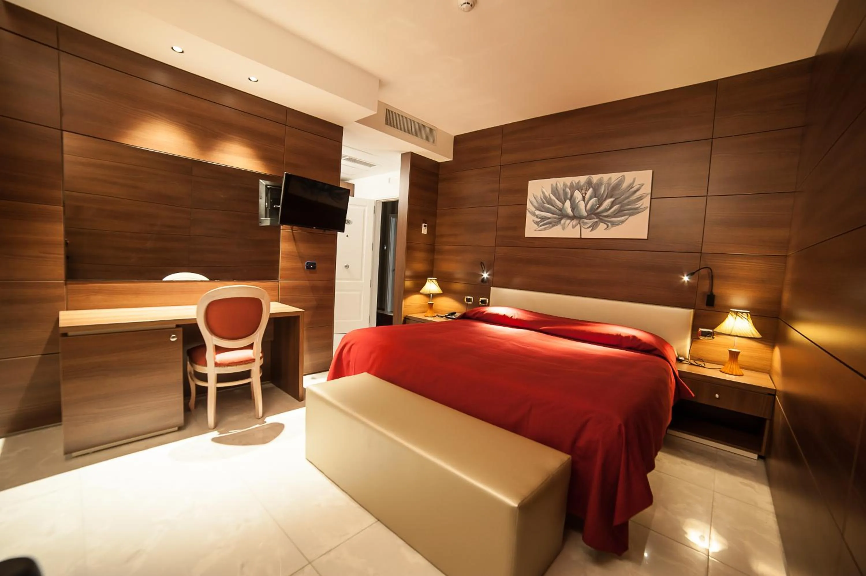 Bed in Family Center Hotel