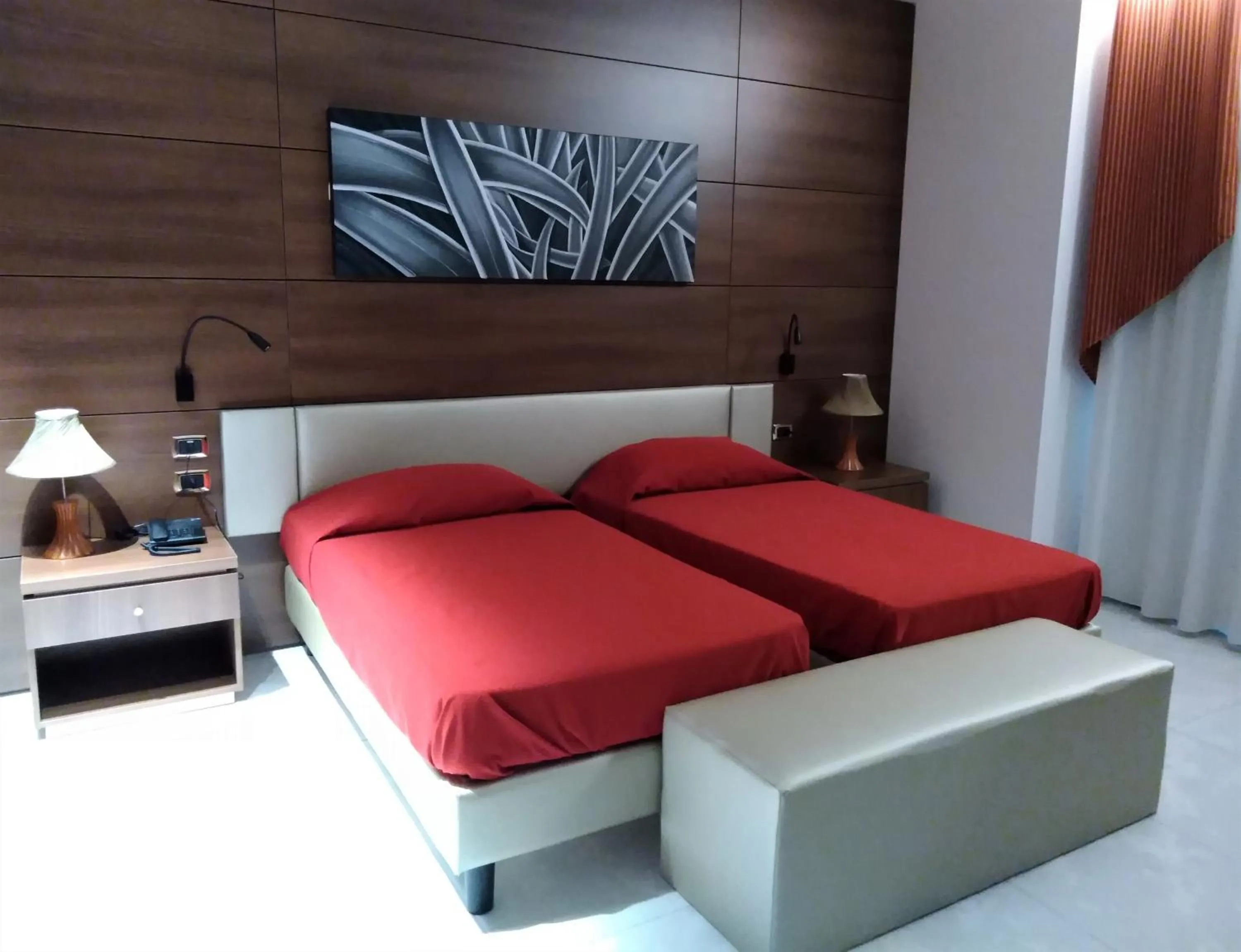 Bed in Family Center Hotel
