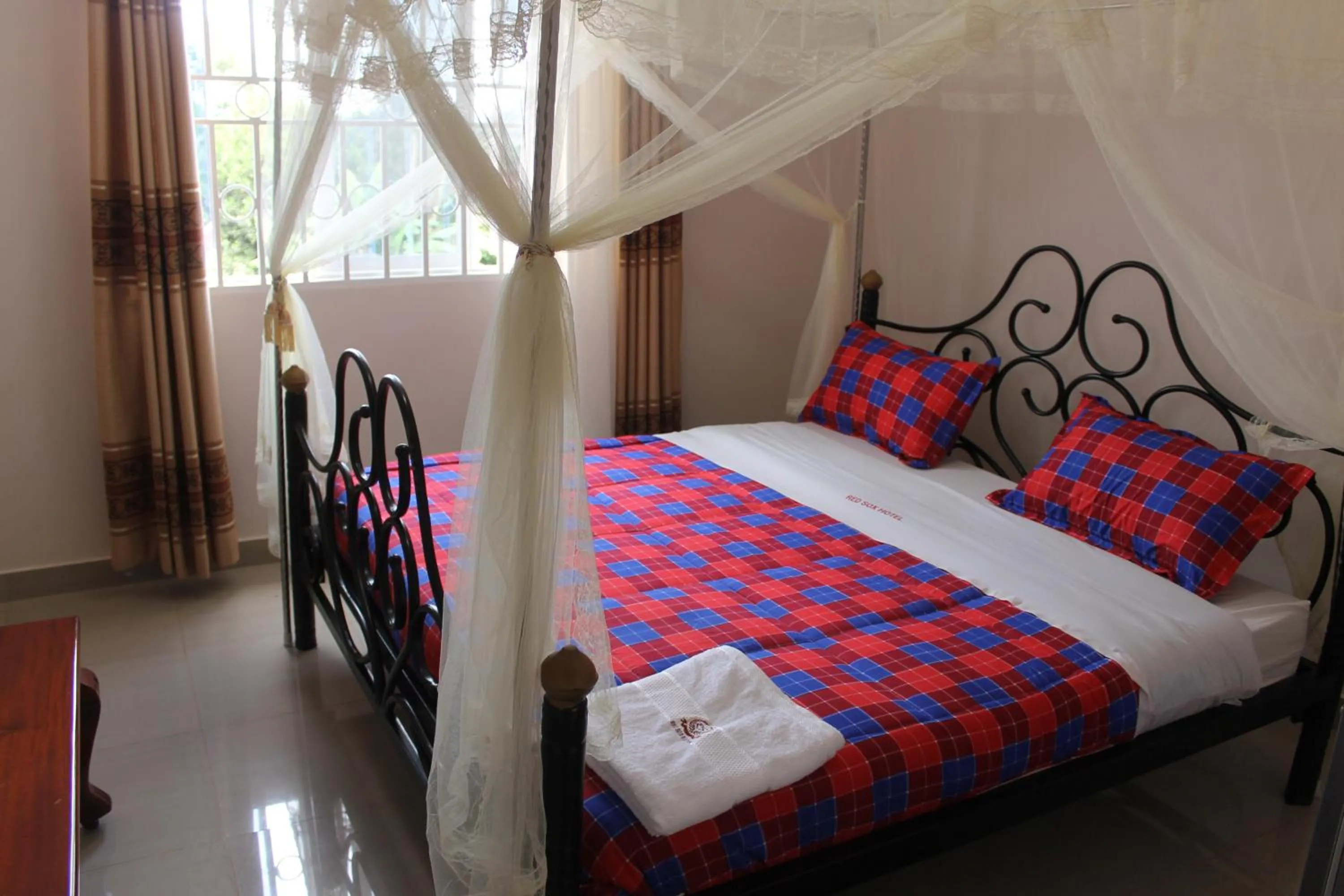 Bed in Red Sox Hotel Ltd