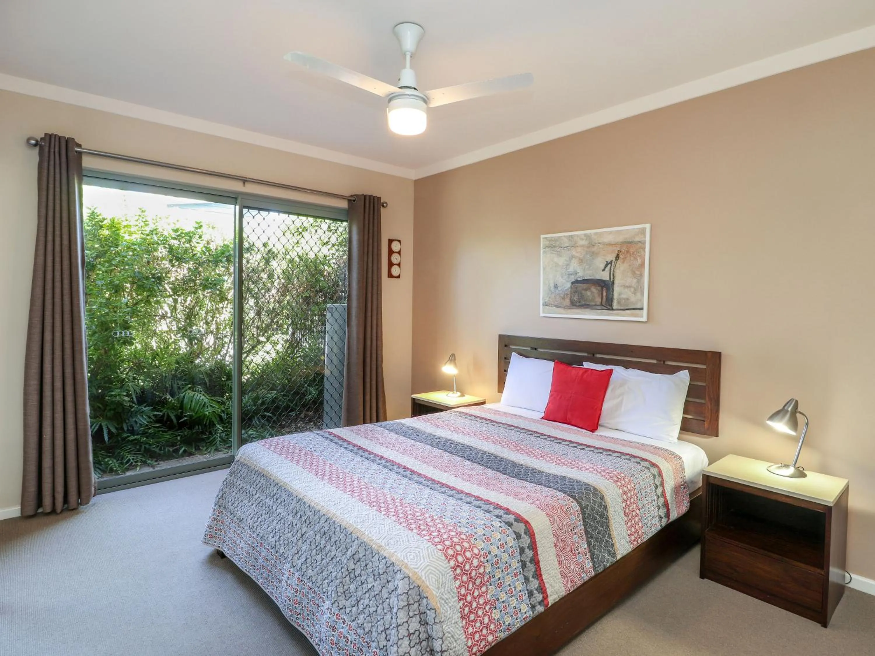 Bed in Bayshore Beachside Resort