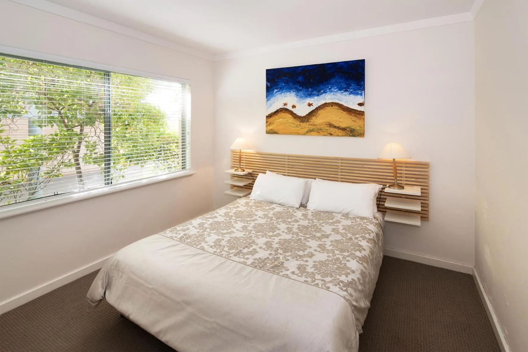 Bed in Bayshore Beachside Resort