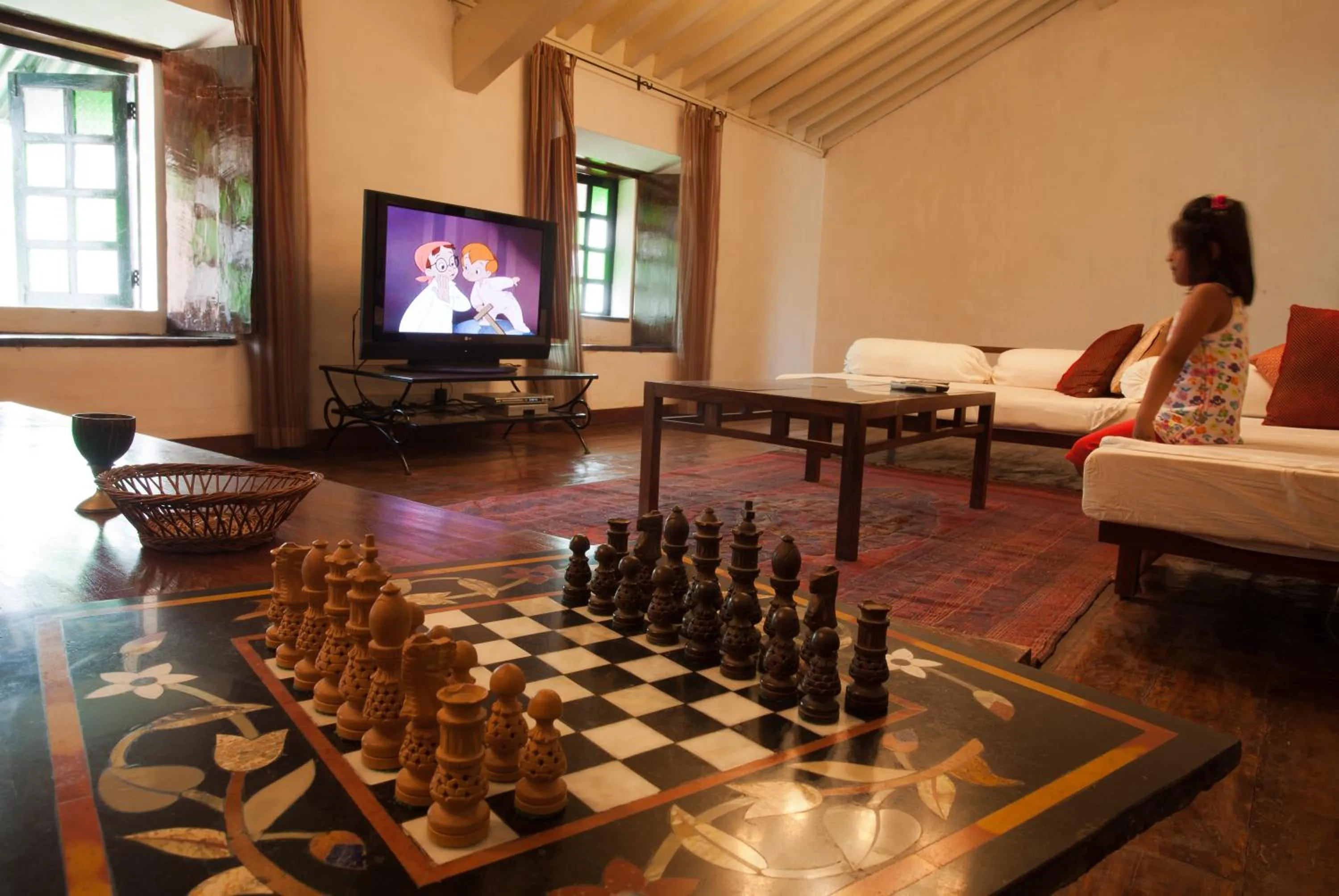 Communal lounge/ TV room in Siolim House