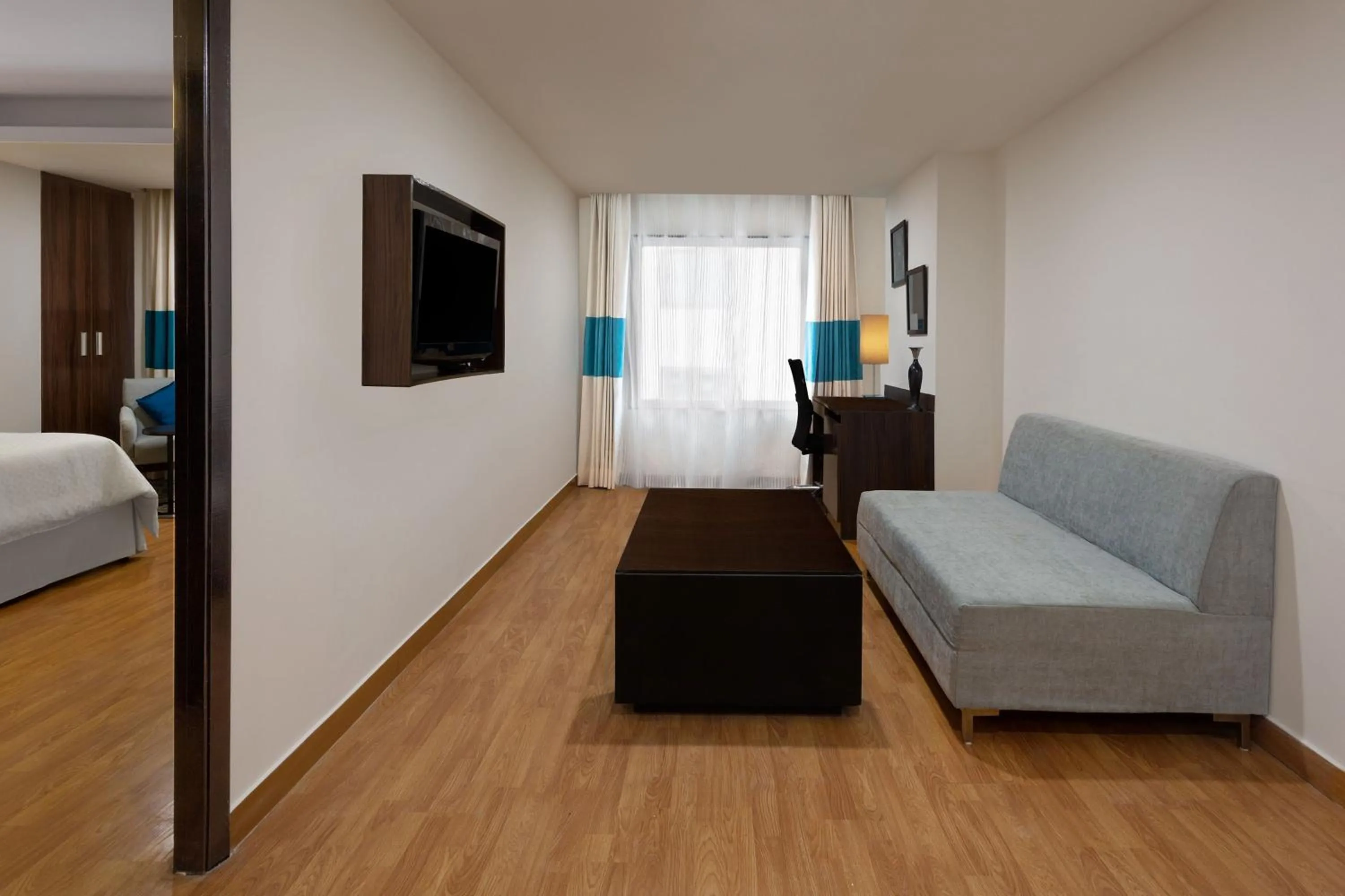 Living room, Bed in Four Points by Sheraton Vadodara