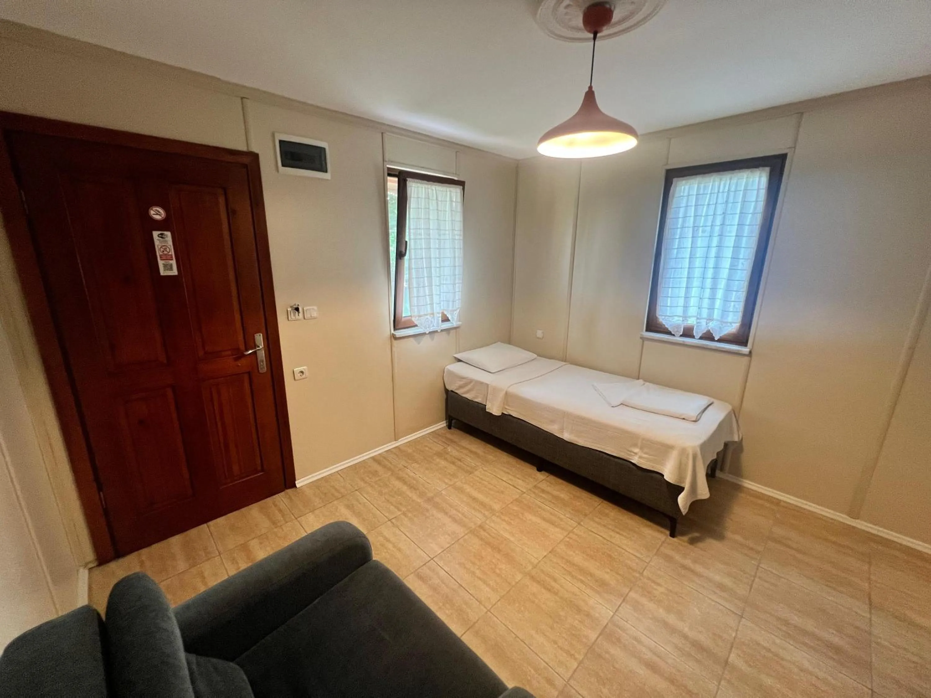 Seating area, Bed in Grenadine Lodge