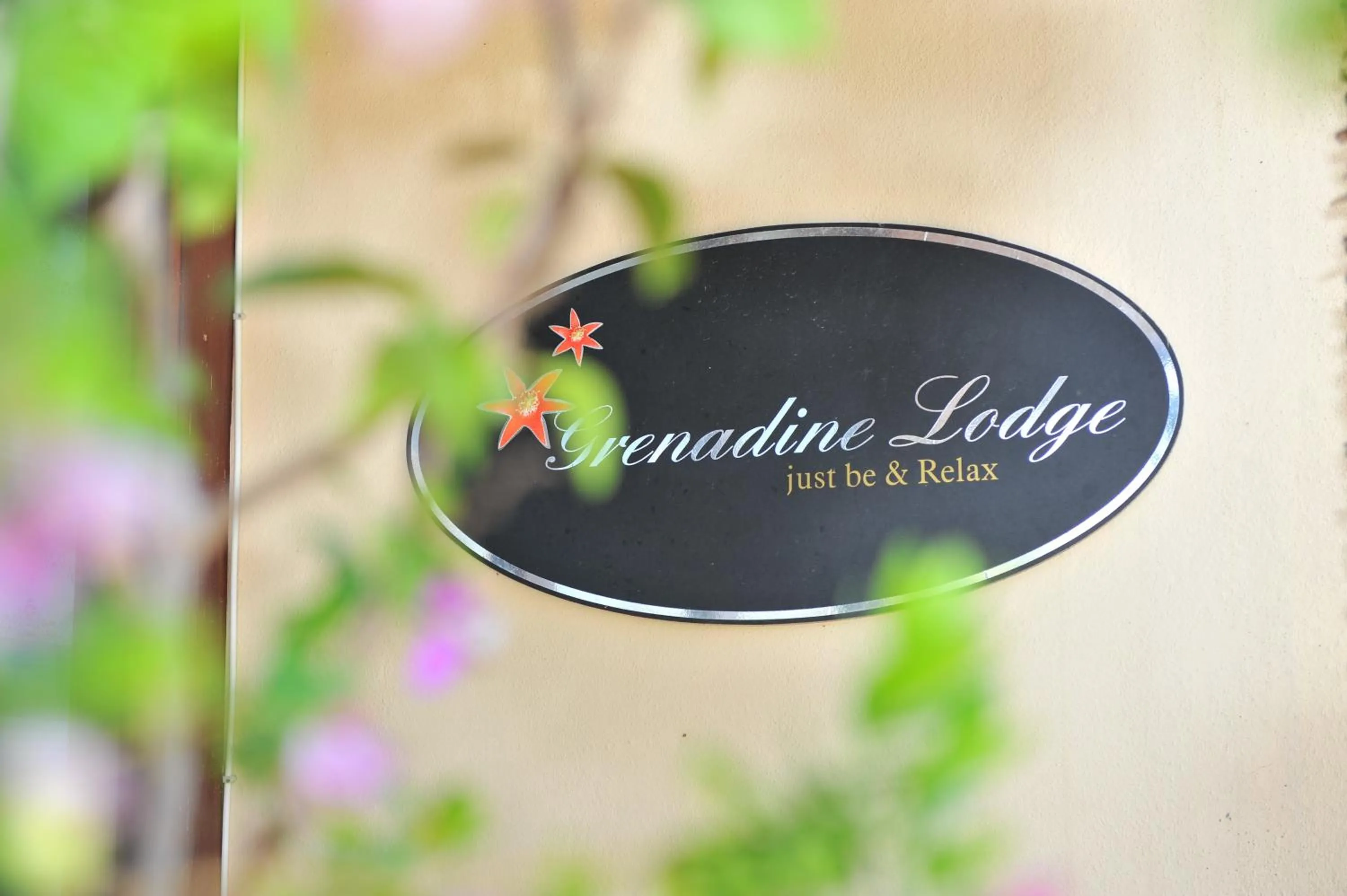 Property logo or sign in Grenadine Lodge
