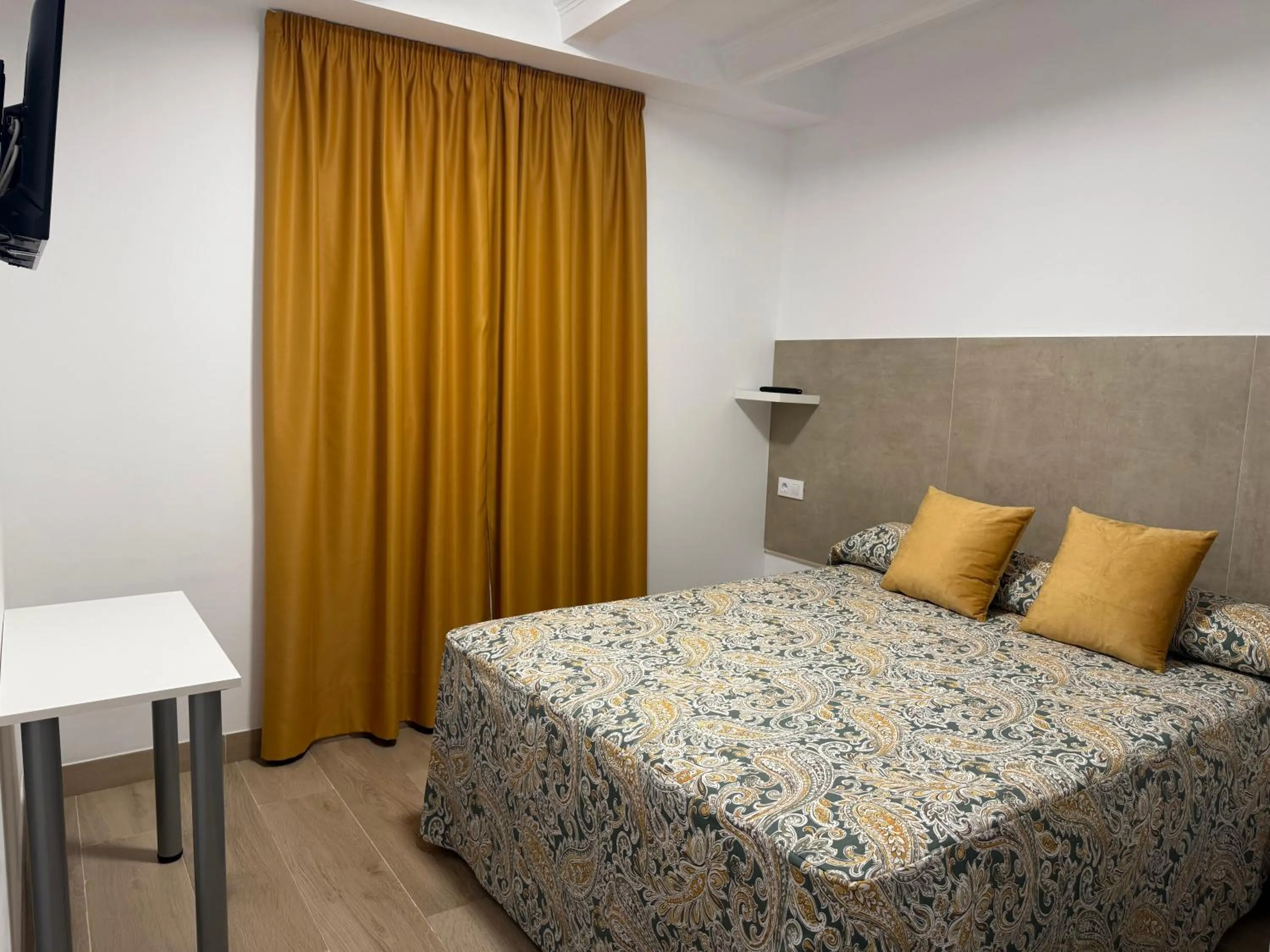 Bed in Hotel Quitagolpe