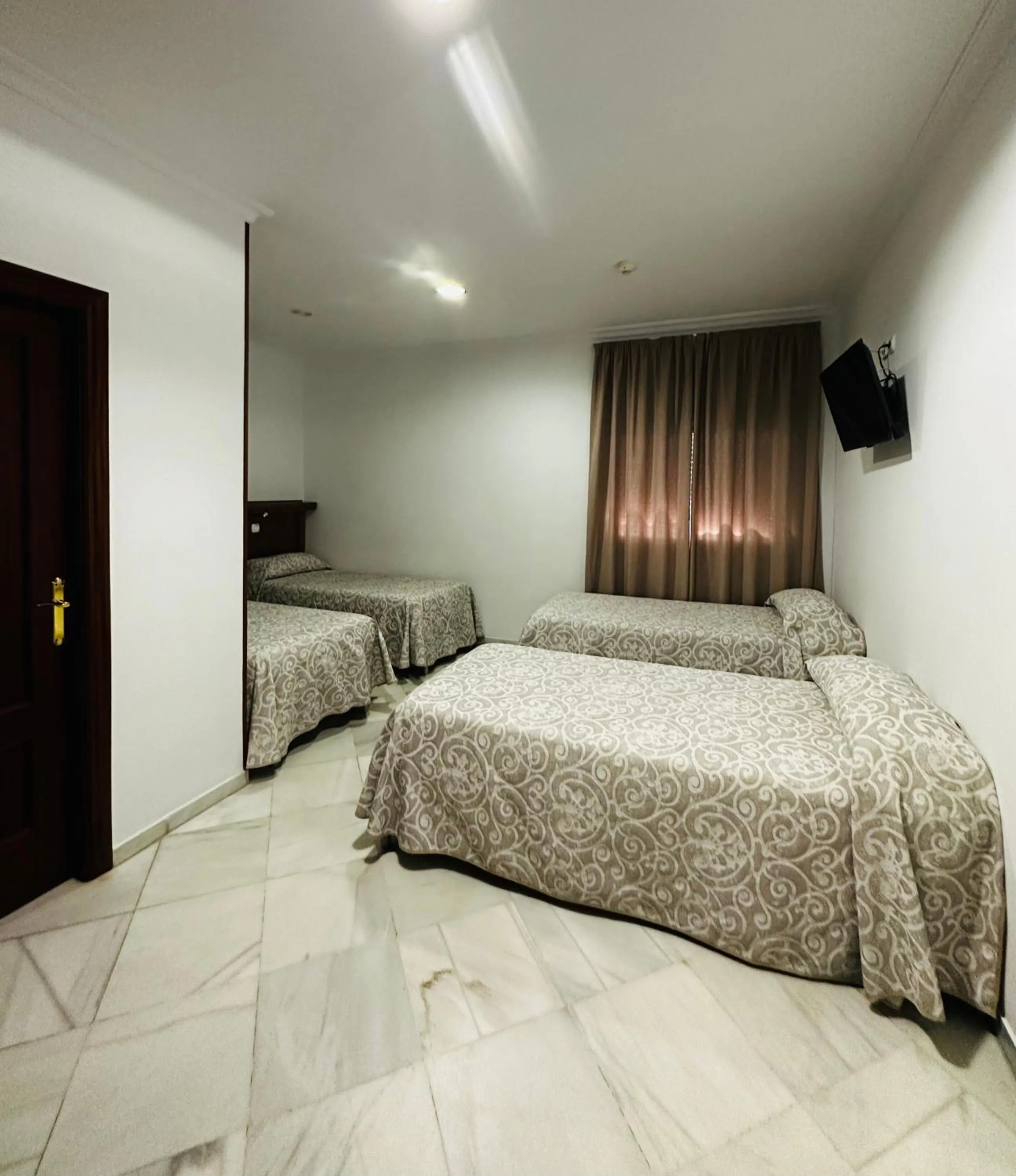 Bed in Hotel Quitagolpe