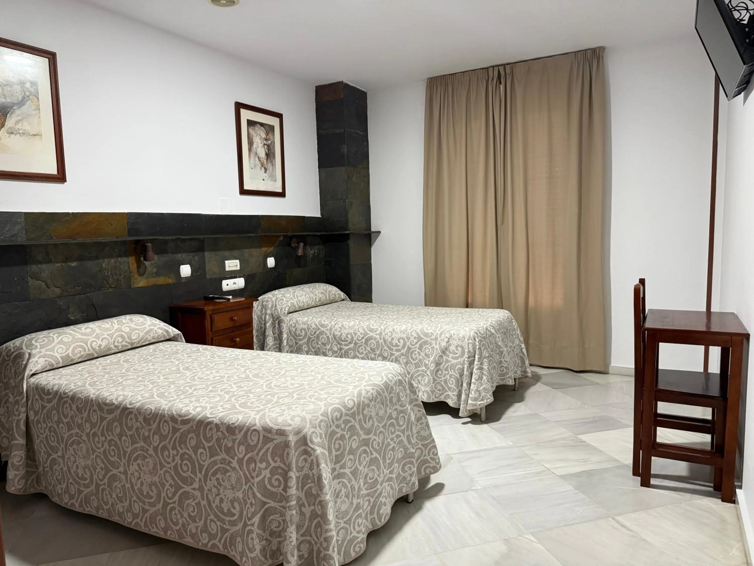 Bed in Hotel Quitagolpe