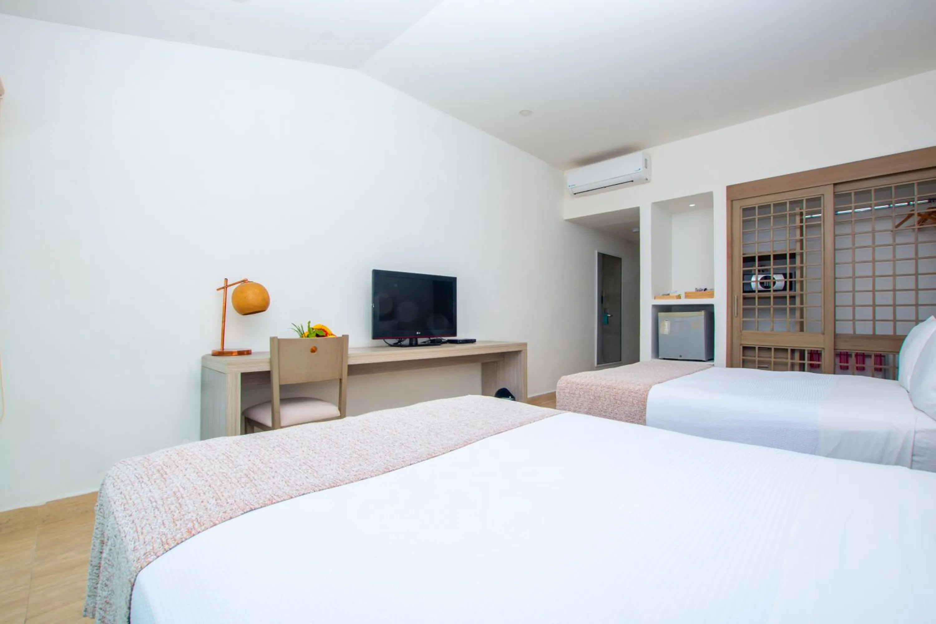 Photo of the whole room, Bed in Tamaca Beach Resort