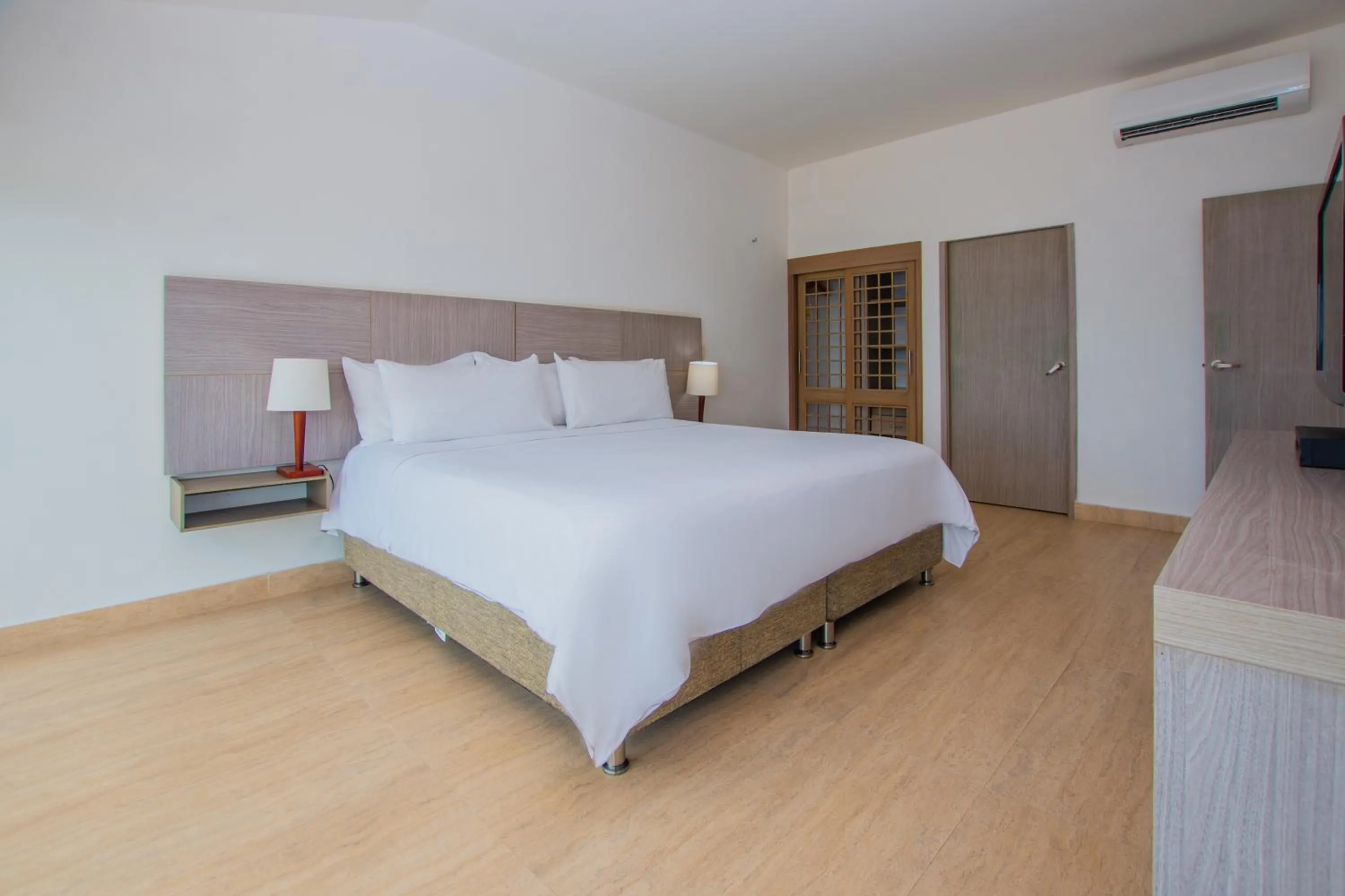 Photo of the whole room, Bed in Tamaca Beach Resort