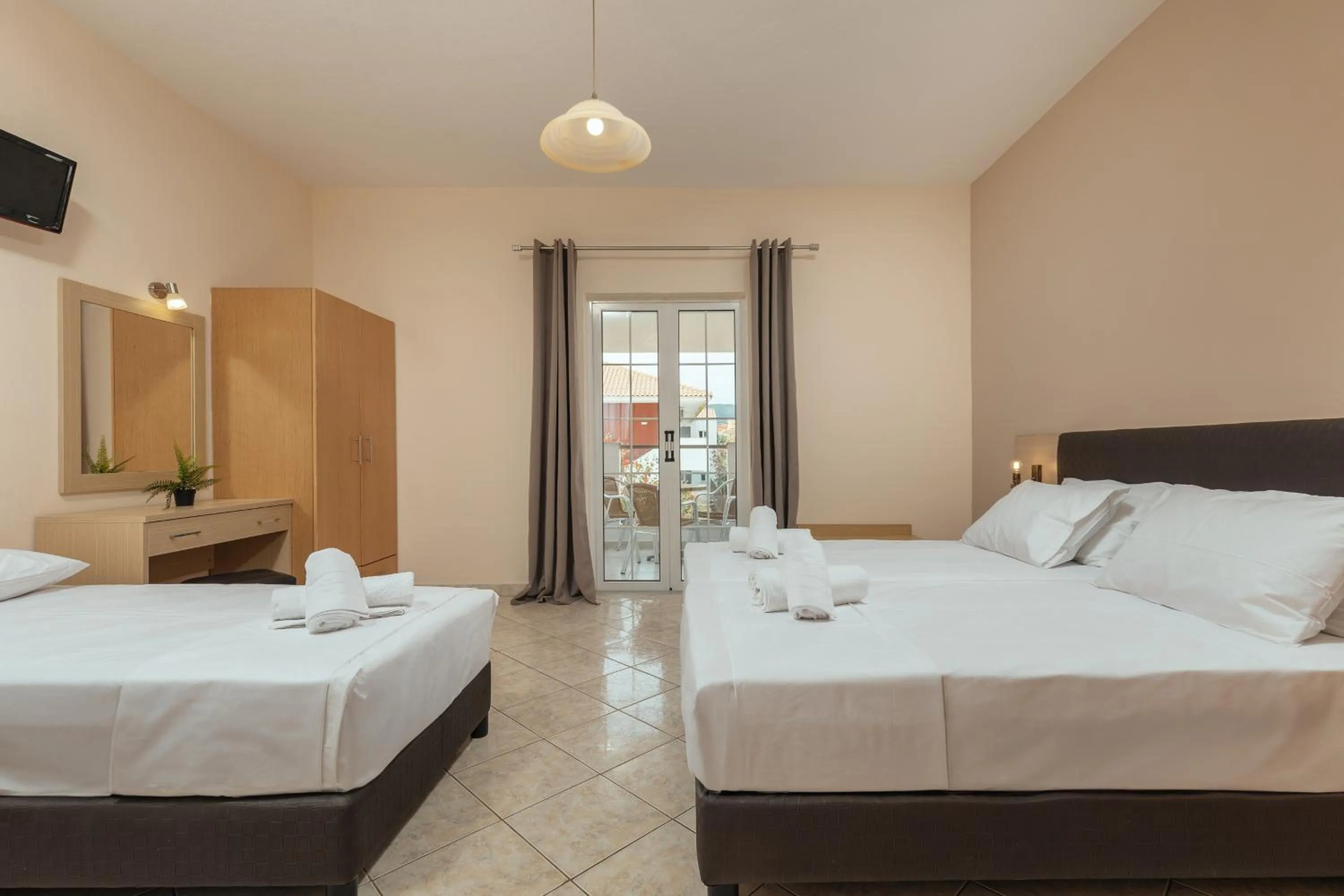 Bed in Yakinthos Hotel