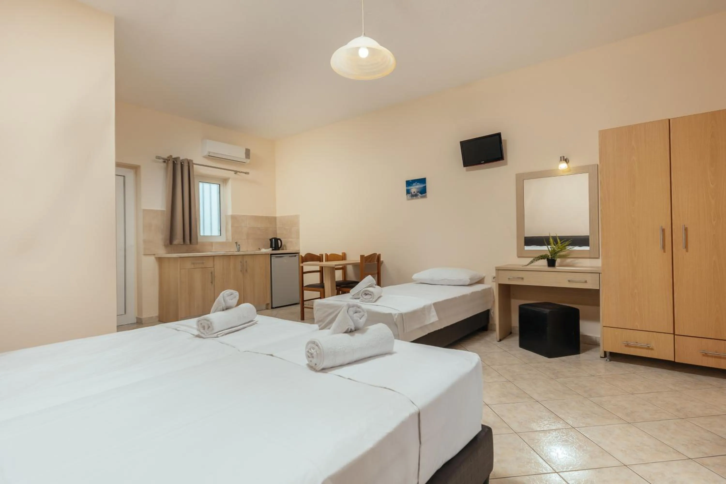 Bed in Yakinthos Hotel