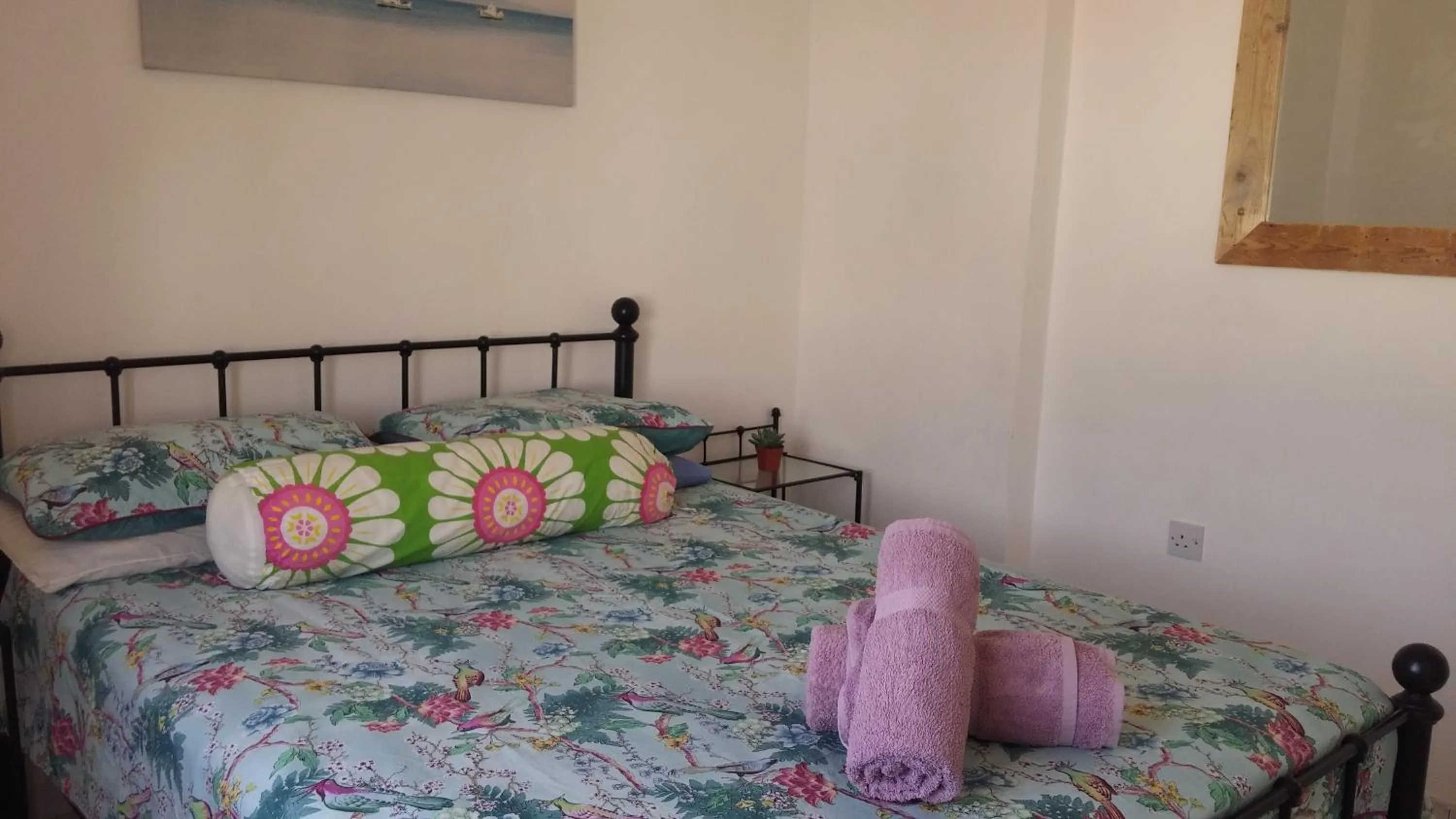 Bed in Athena and The Owl Beachside Apt