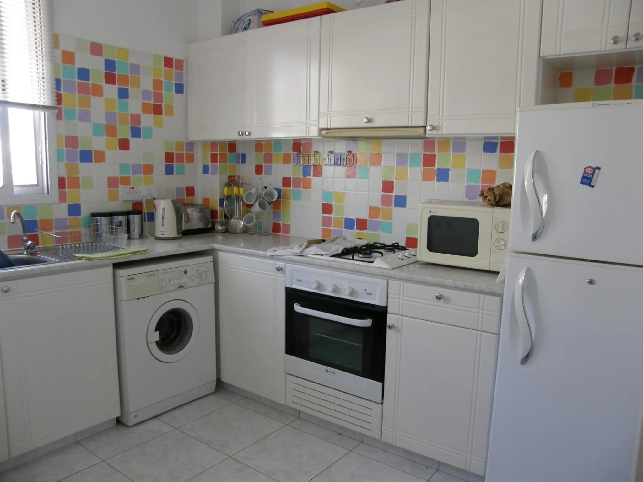 Kitchen or kitchenette in Athena and The Owl Beachside Apt