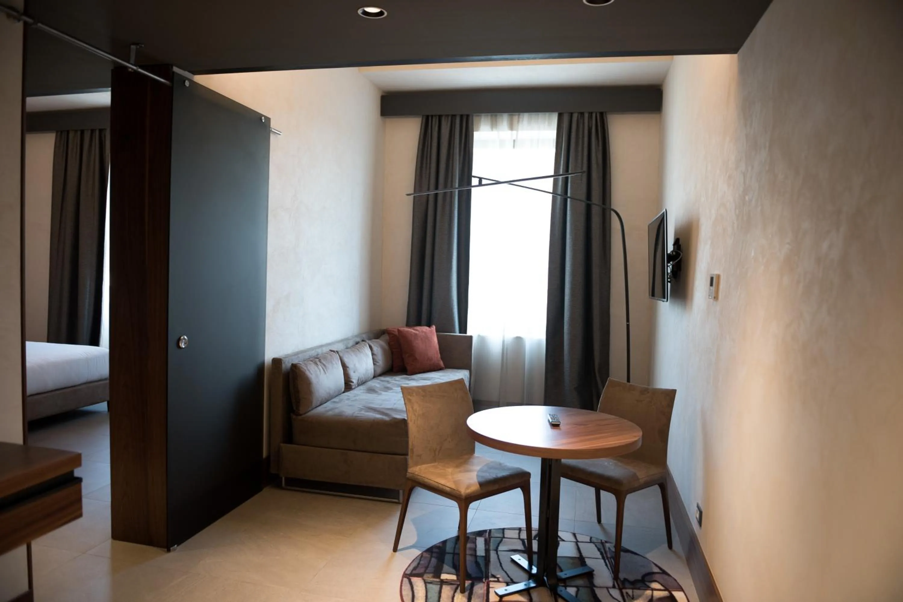 Living room, Bed in Gasometer Urban Suites