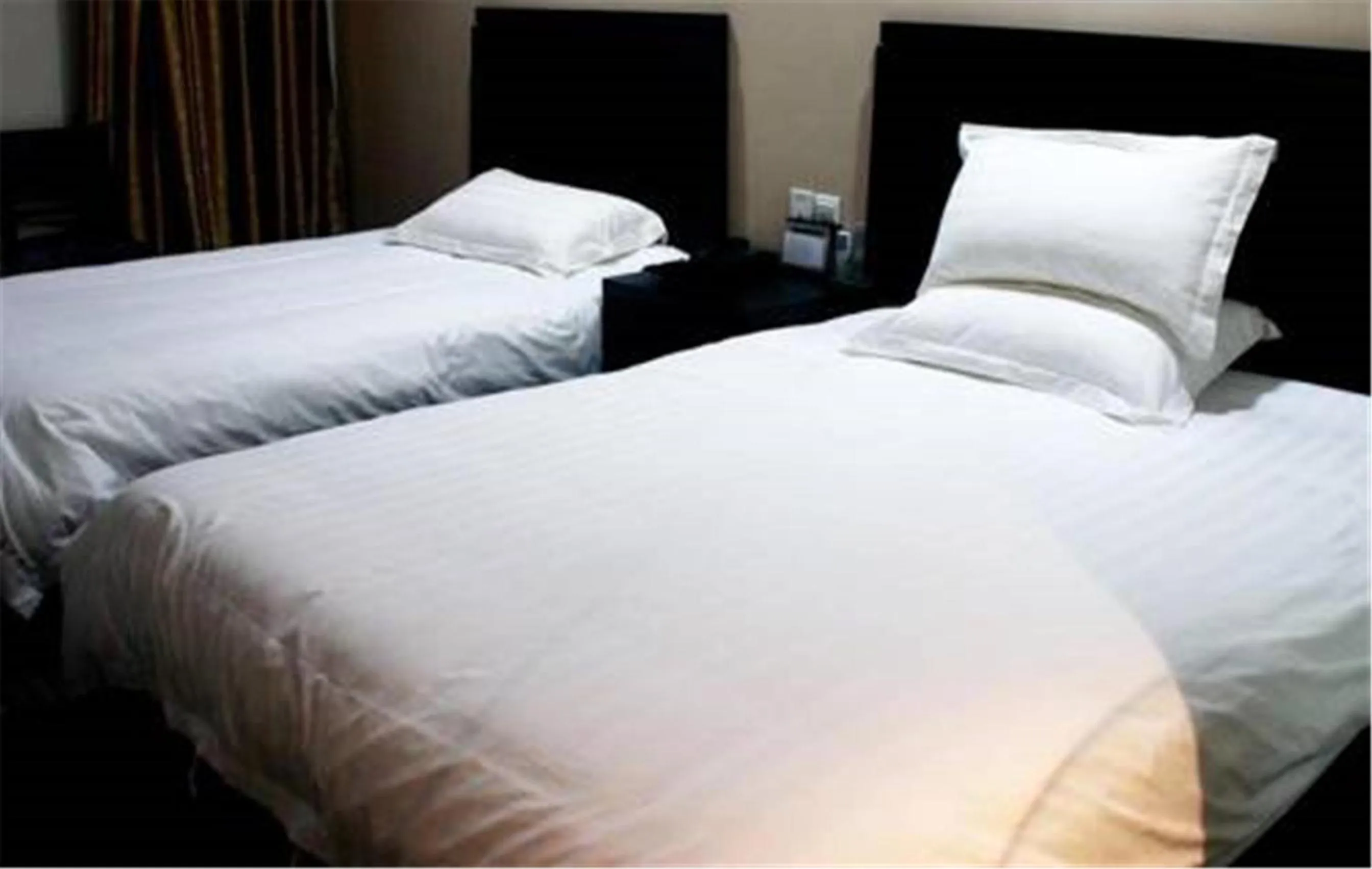 Bed in Hundred Centuries Hotel