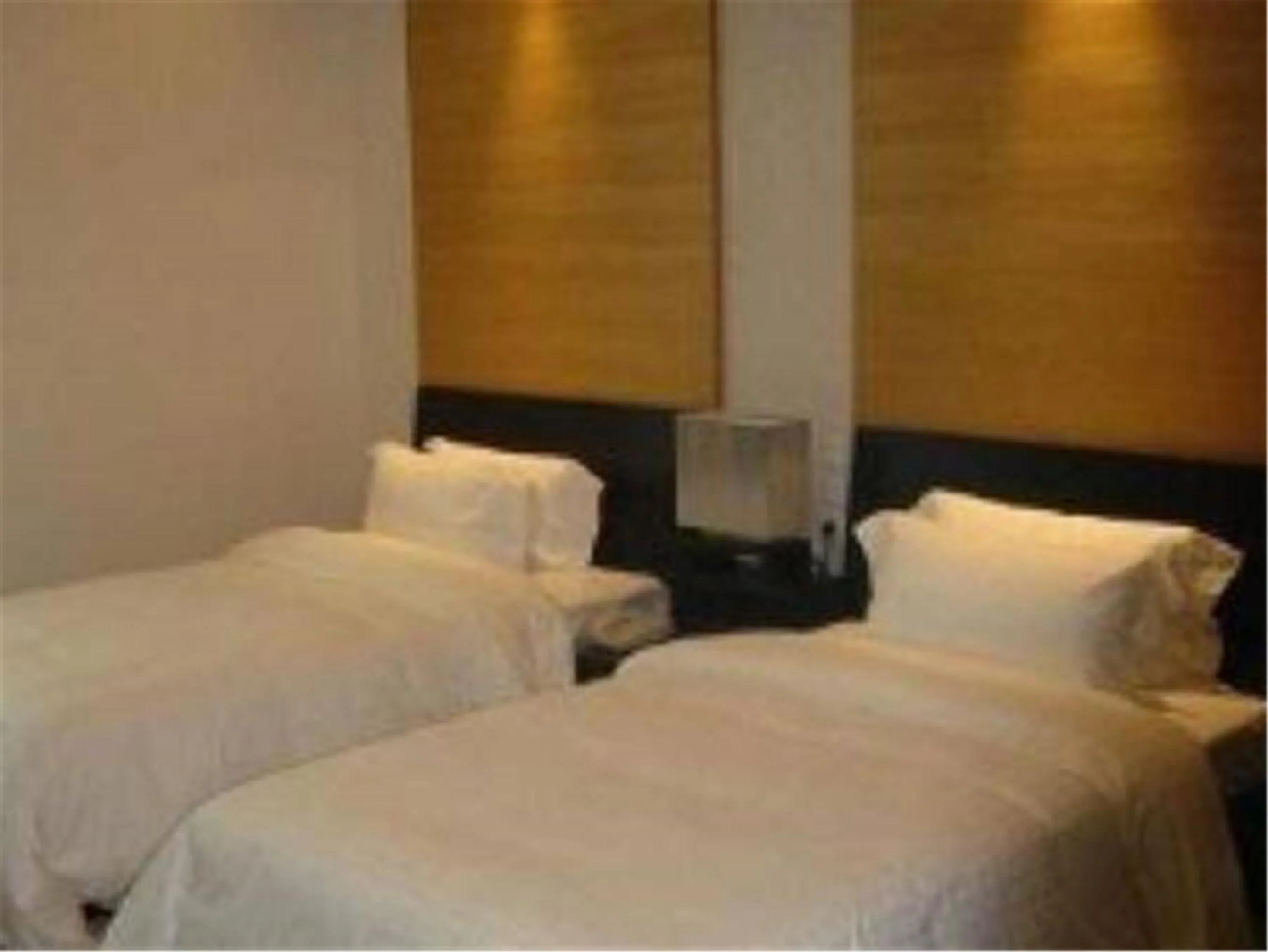 Bed in Hundred Centuries Hotel