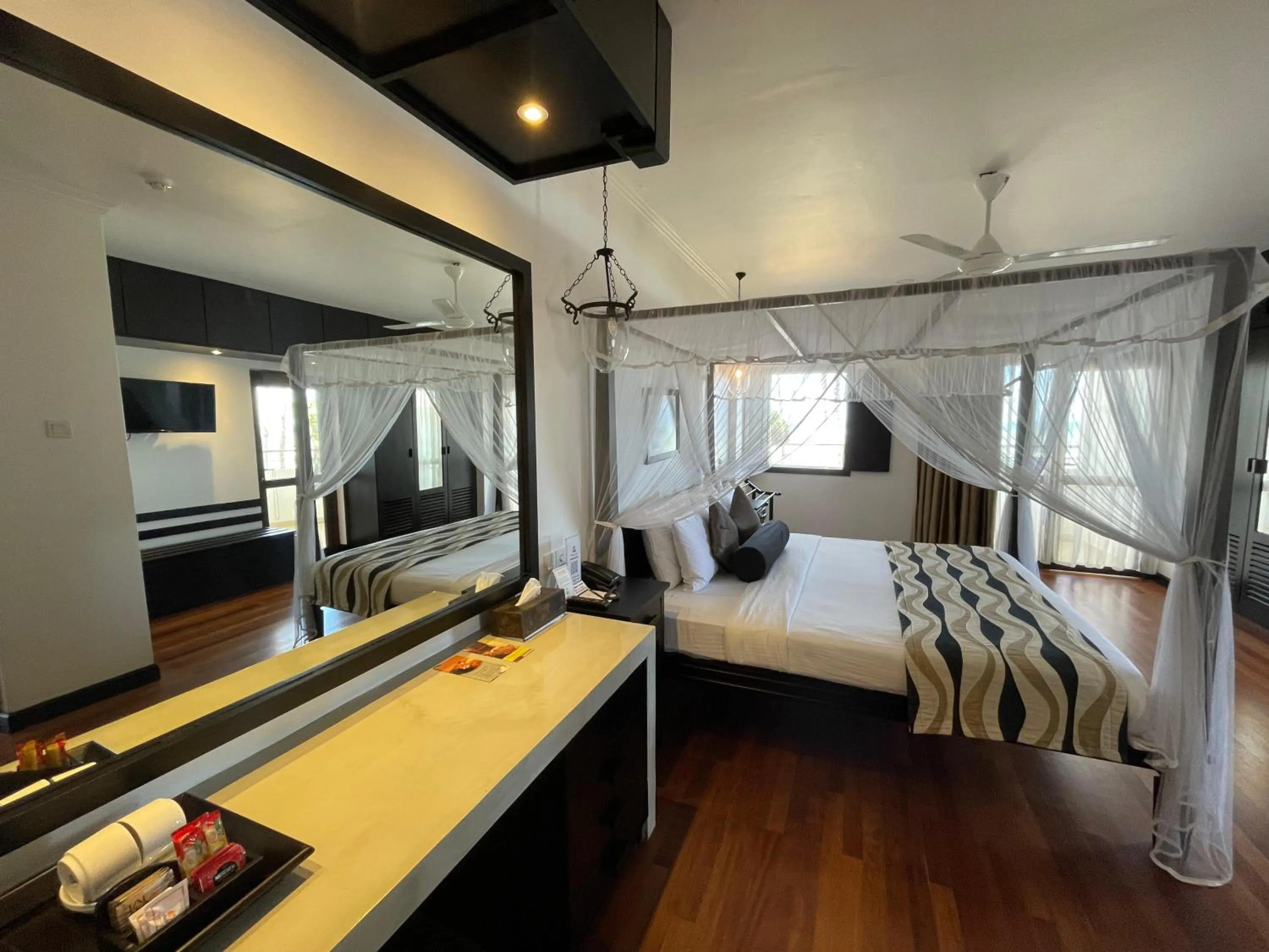 Bed in Tangerine Beach Hotel