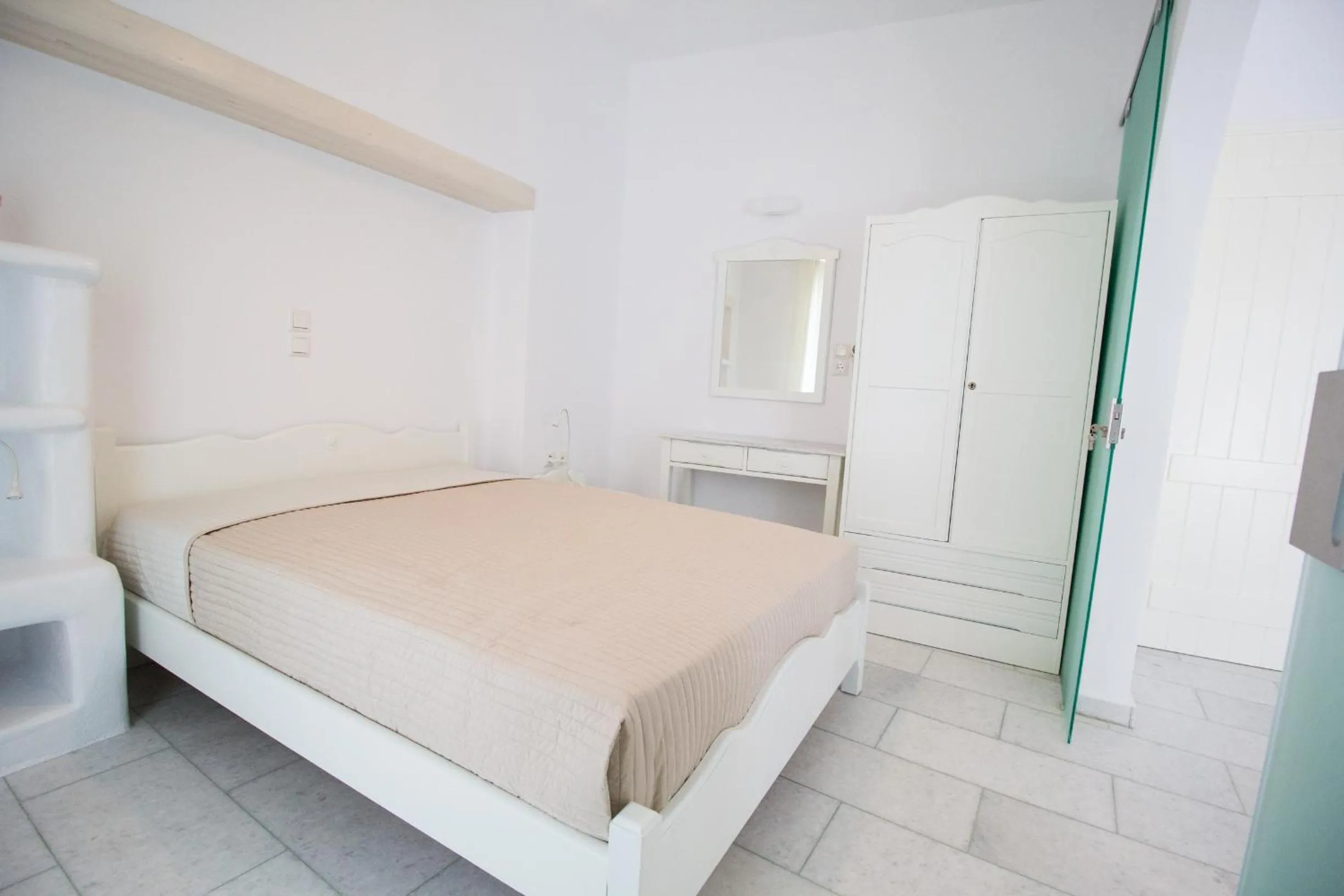 Bed in Aspasia Luxury Apartments