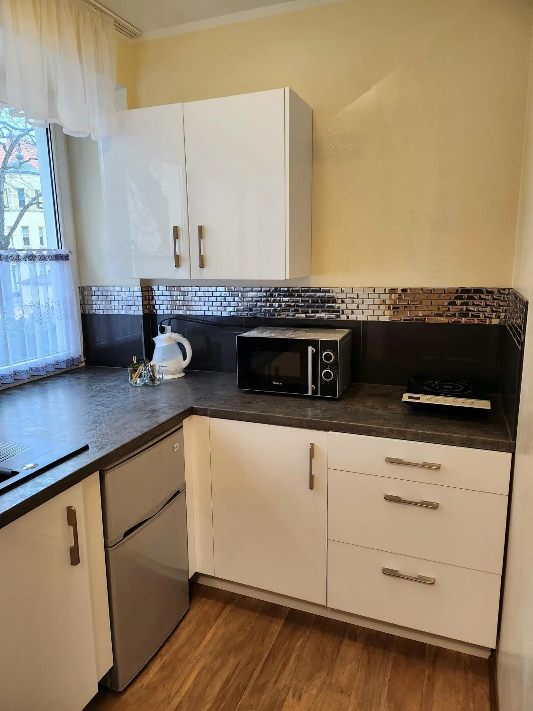 Kitchen or kitchenette in Lazur Apartamenty