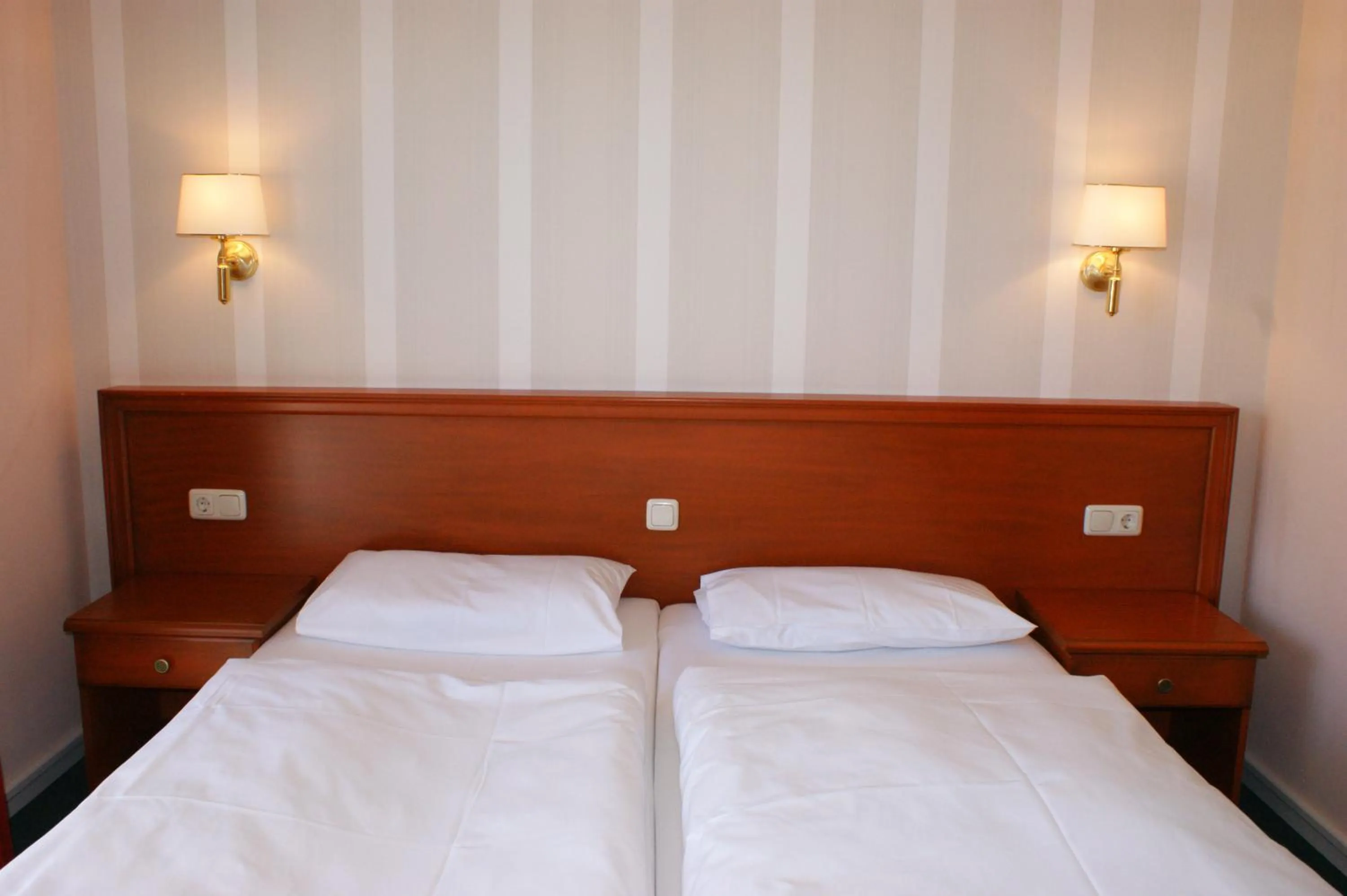 Bed in Hotel Pension Bellevue