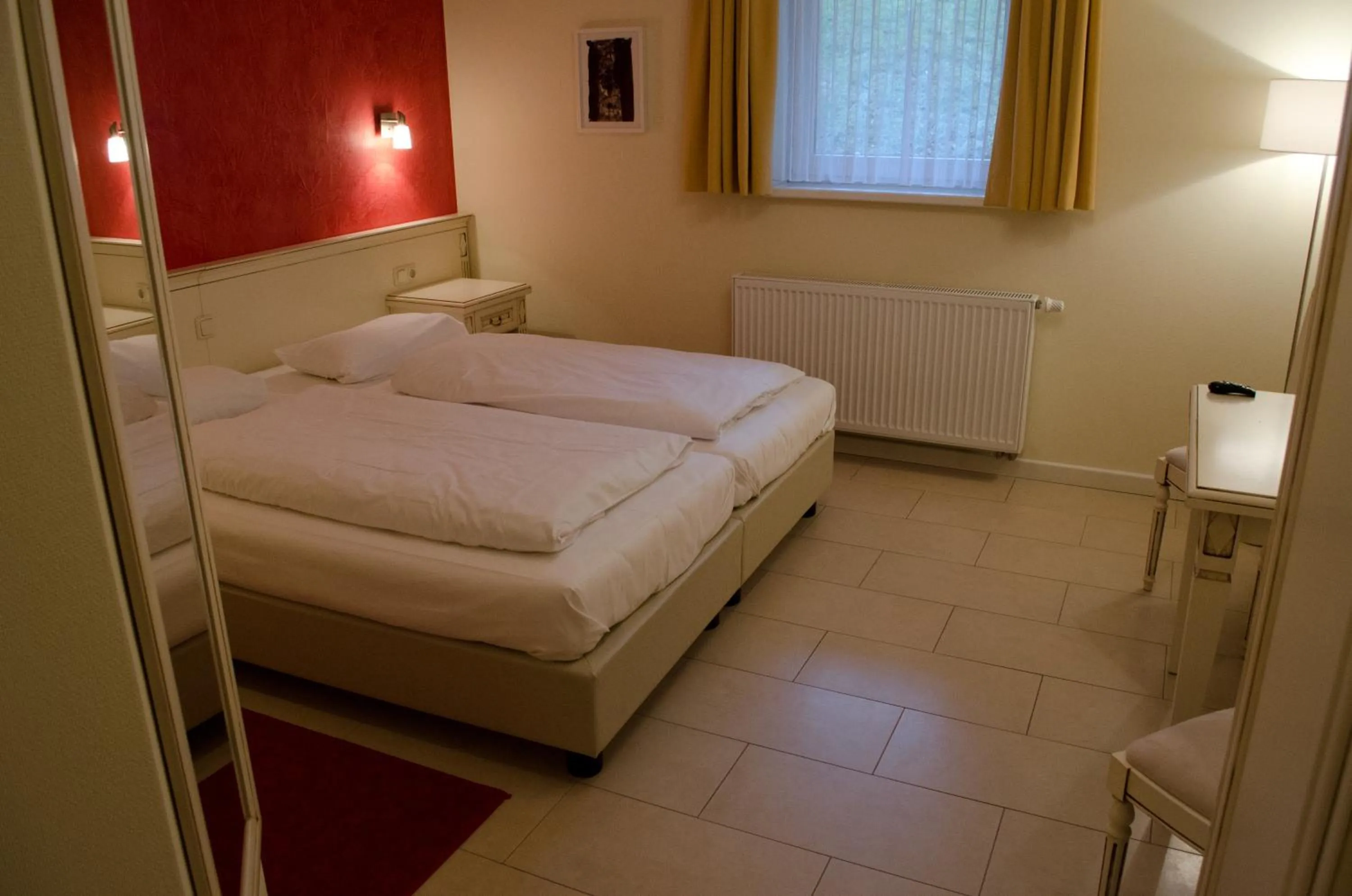 Bed in Hotel Pension Bellevue