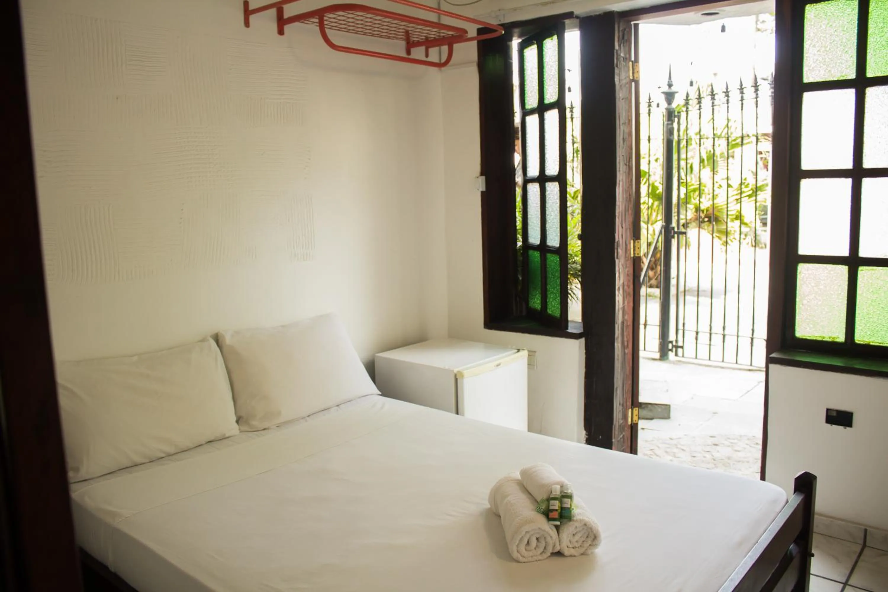 Bed in Pousada Casa da Pedra