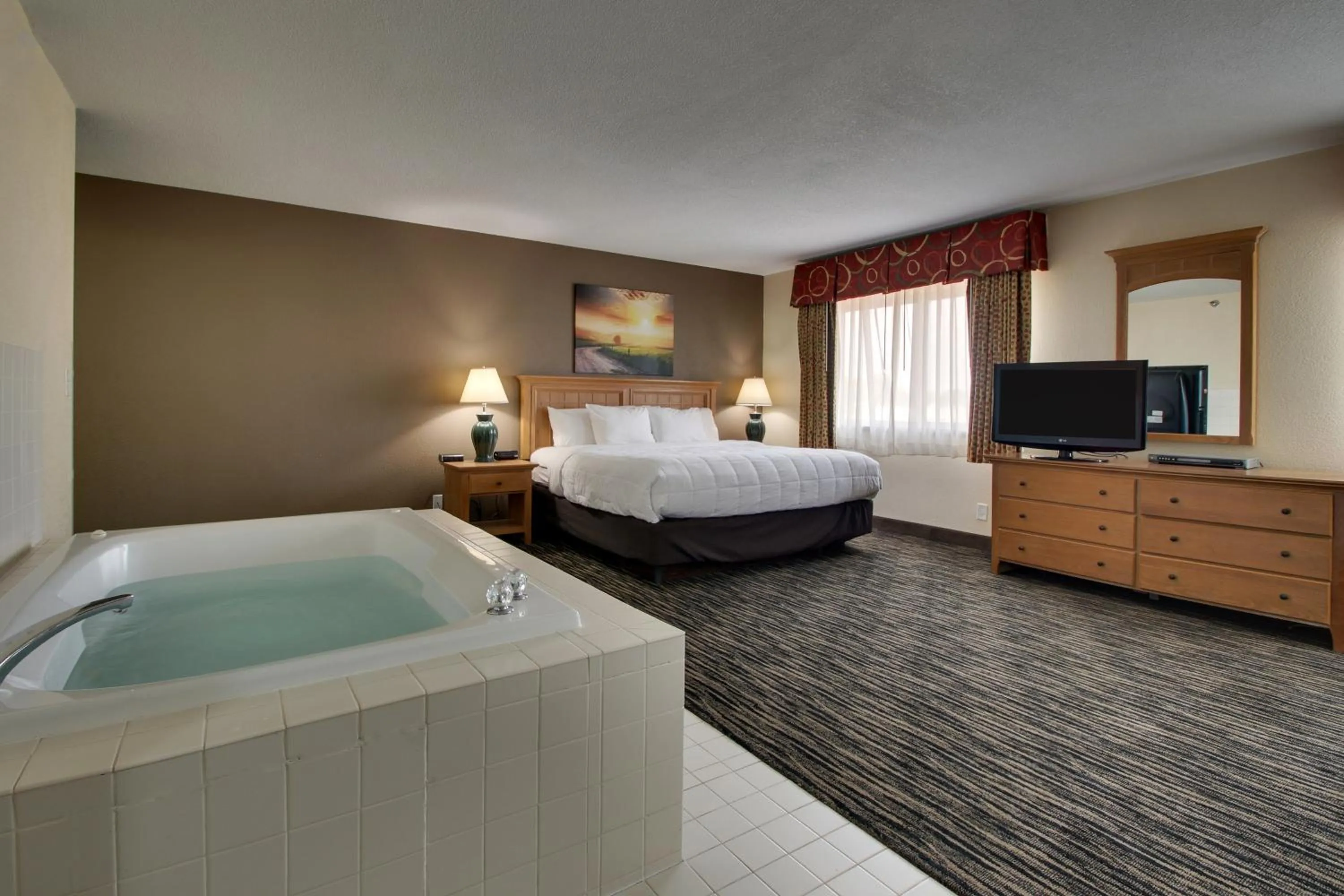 Bed in EverSpring Inn & Suites