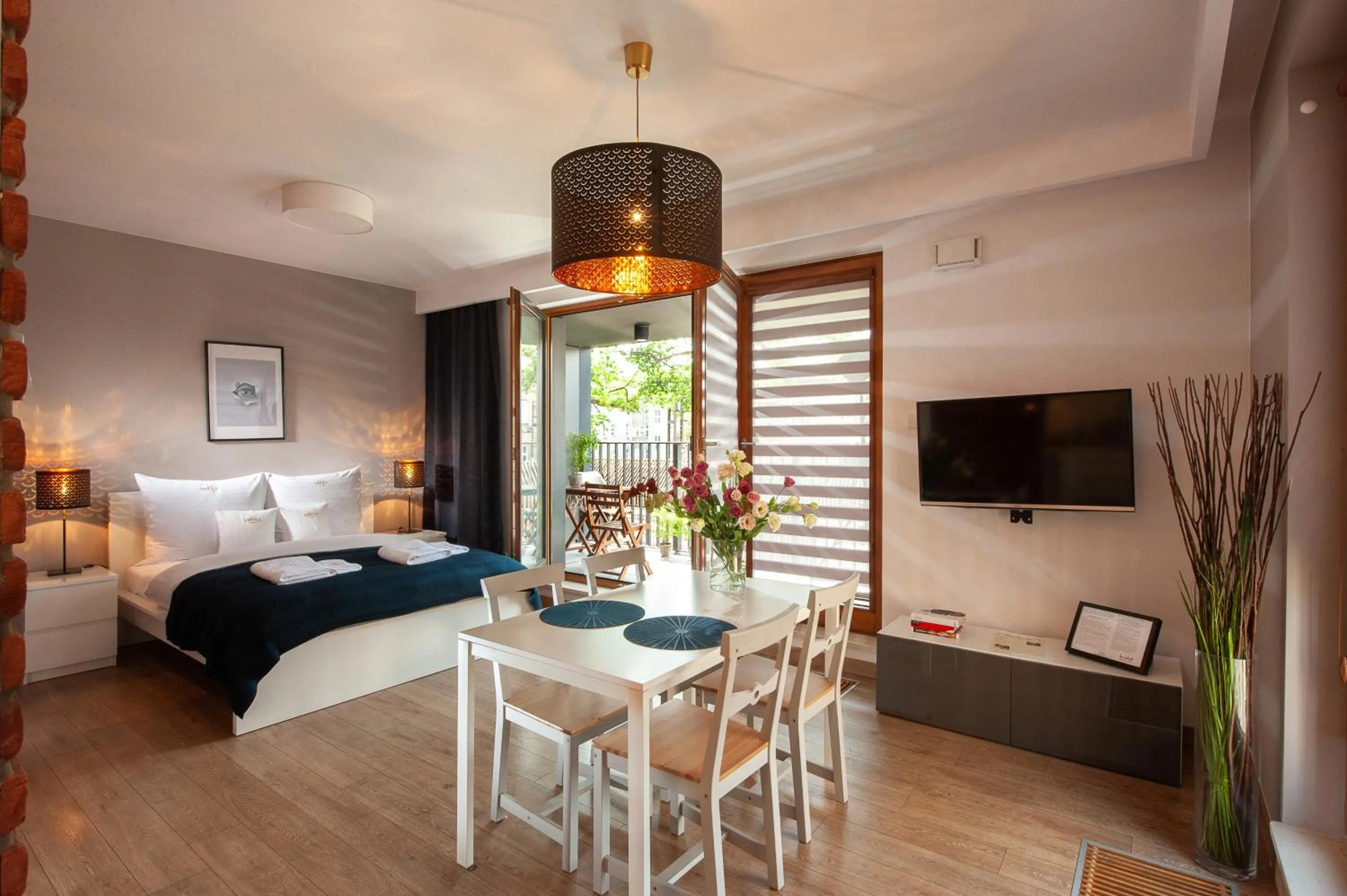 Communal lounge/ TV room, Bed in Browar Lubicz Residence