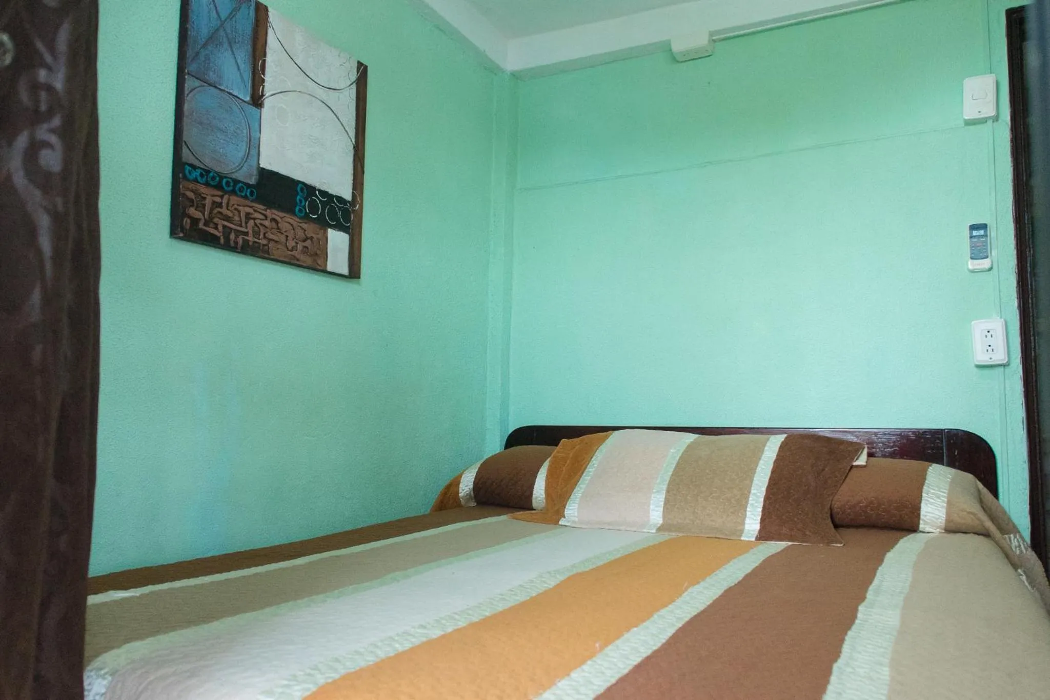 Bed in Posada Nativa Miss Trinie