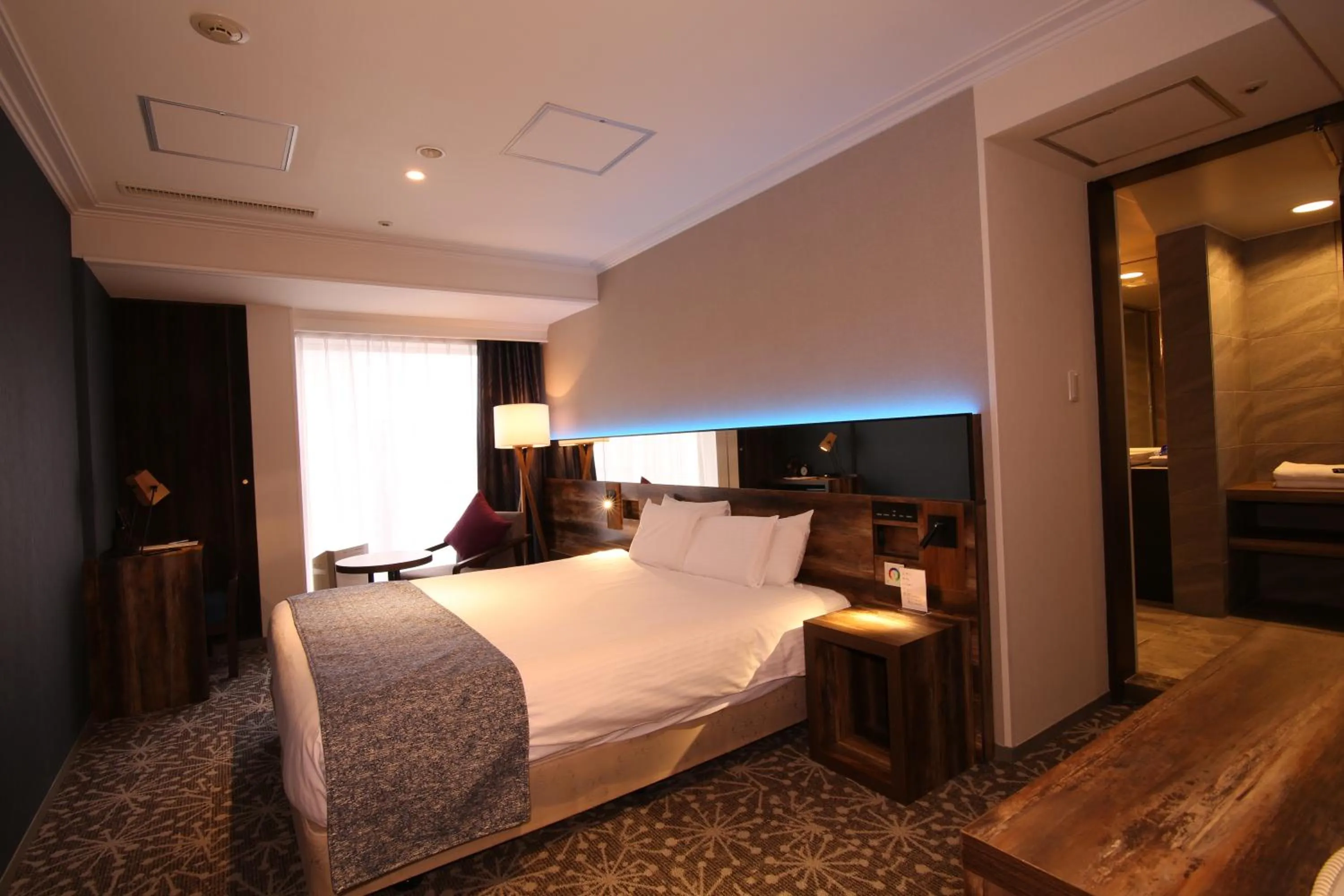 Photo of the whole room, Bed in Quintessa Hotel Sapporo