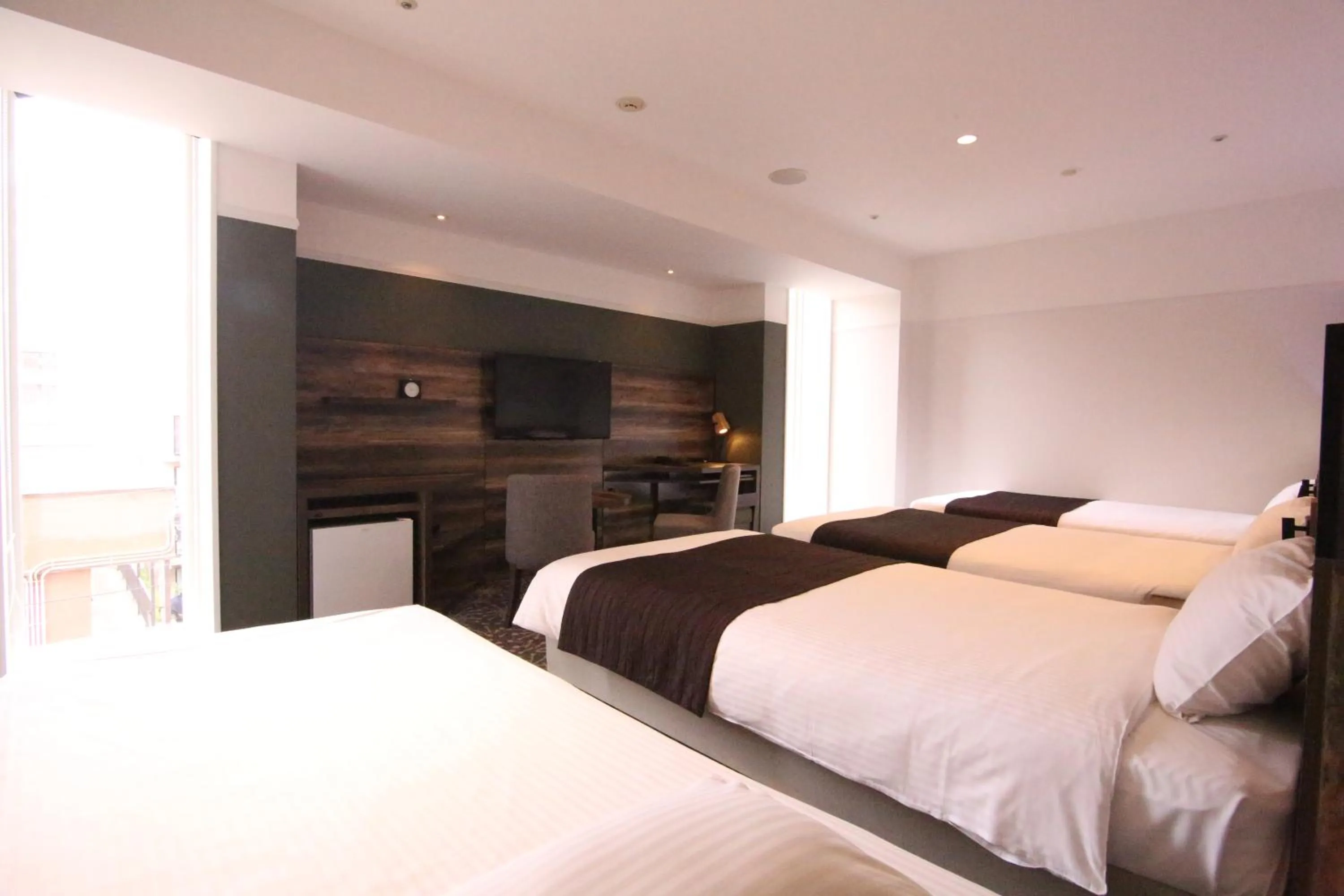 Photo of the whole room, Bed in Quintessa Hotel Sapporo