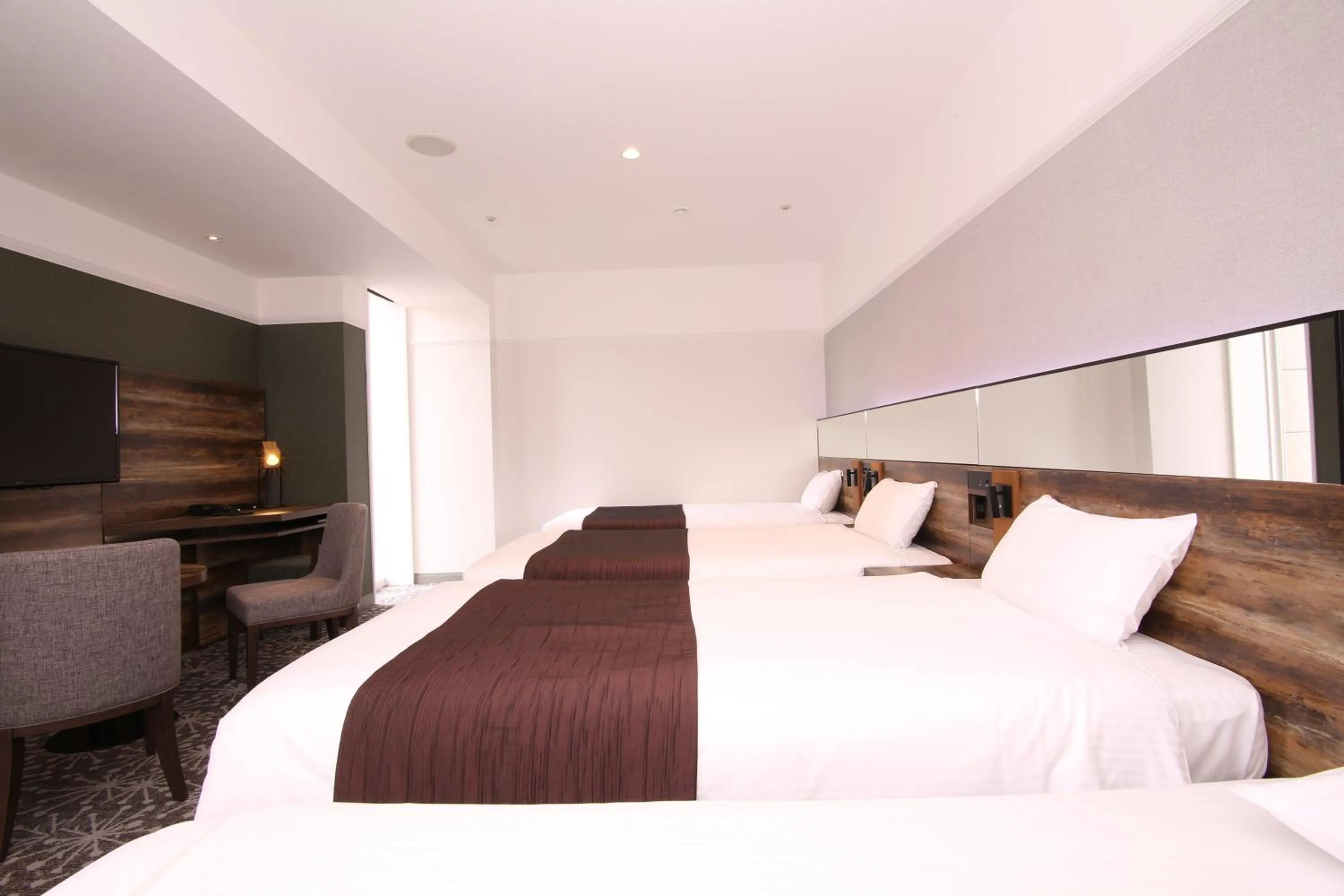 Photo of the whole room, Bed in Quintessa Hotel Sapporo