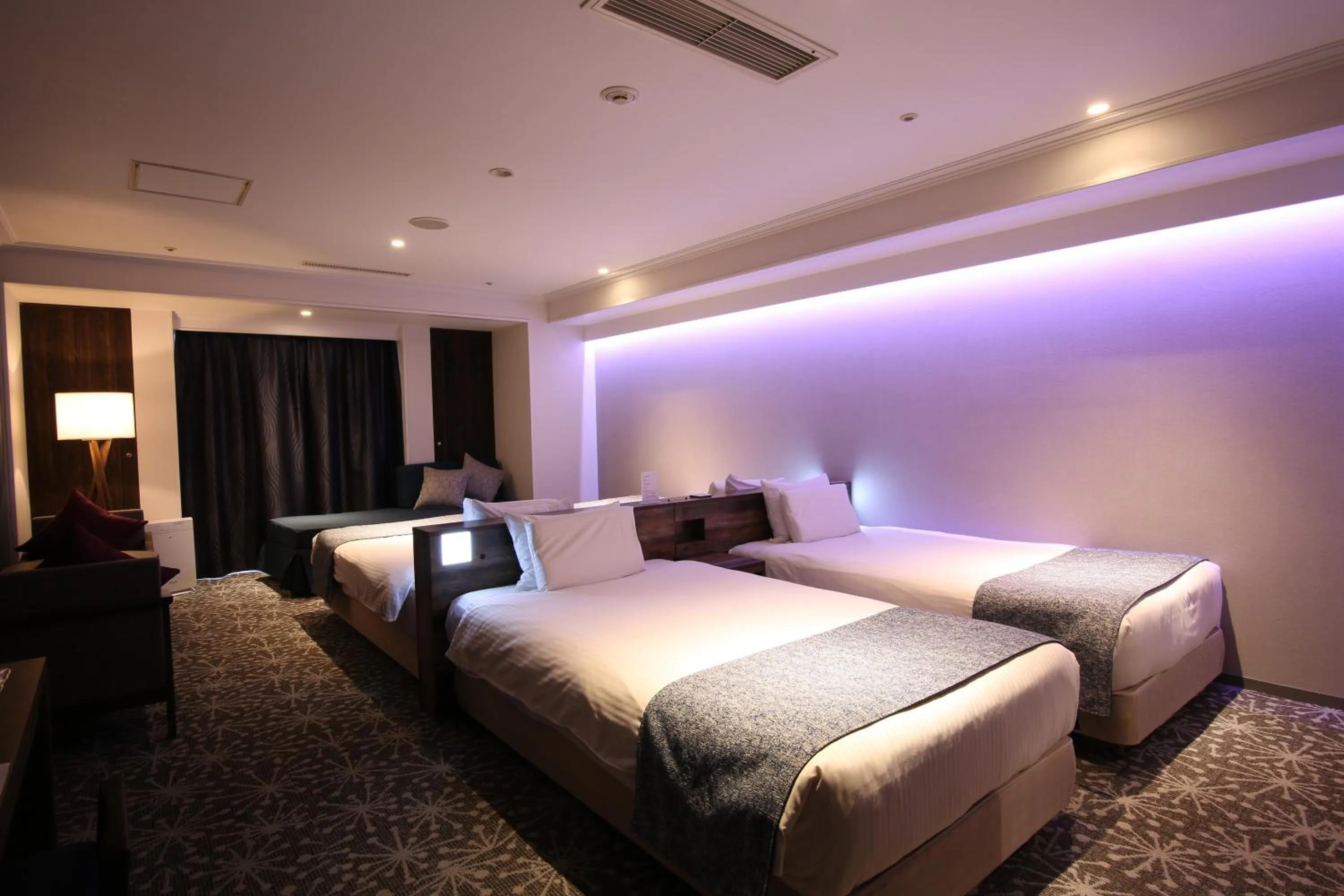 Photo of the whole room, Bed in Quintessa Hotel Sapporo