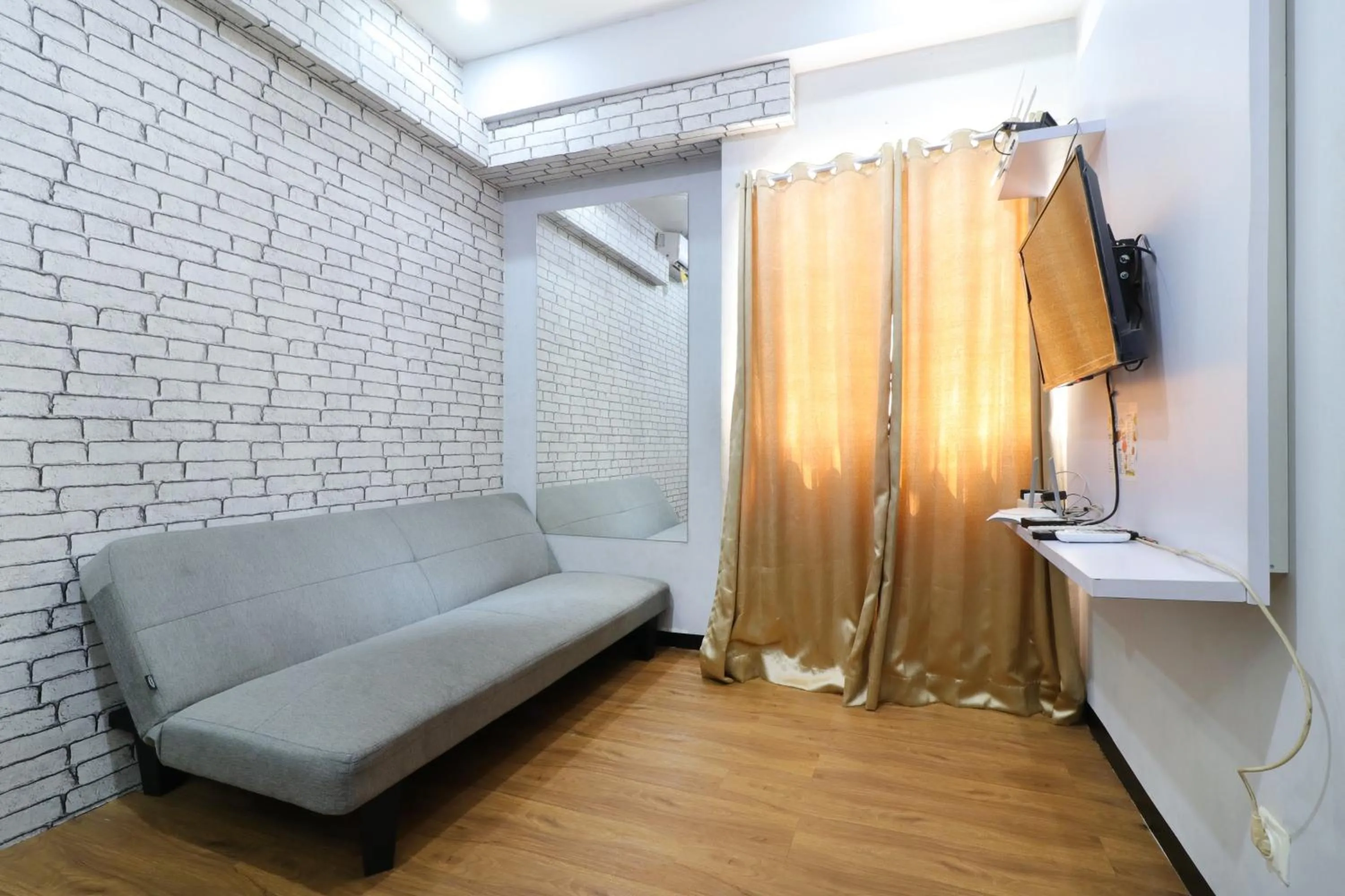 Living room in The Suite Metro Apartment by King Official