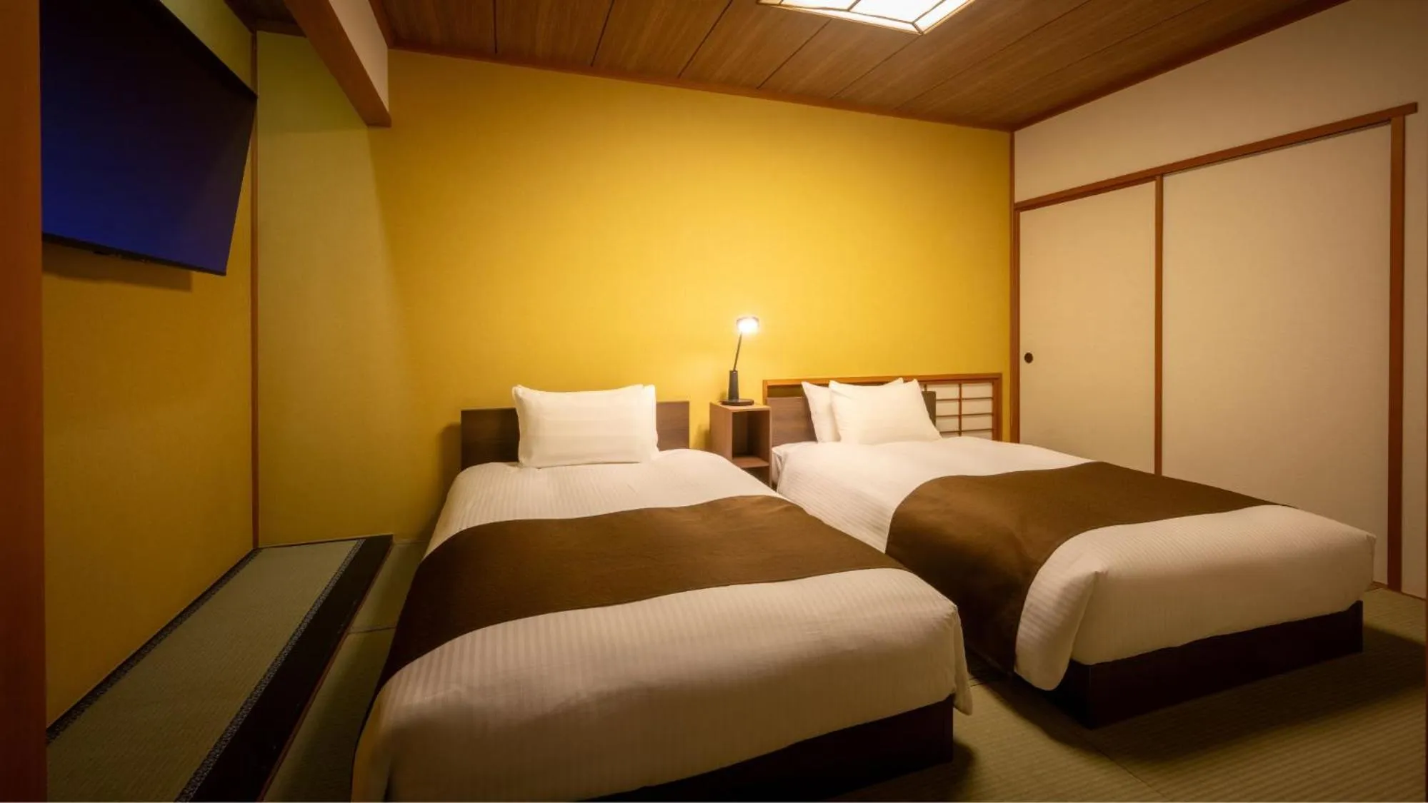 Bed in Marumine Kanko Hotel