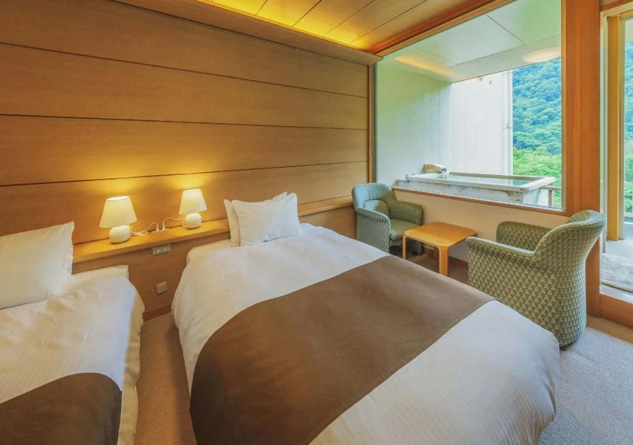 Bed in Marumine Kanko Hotel