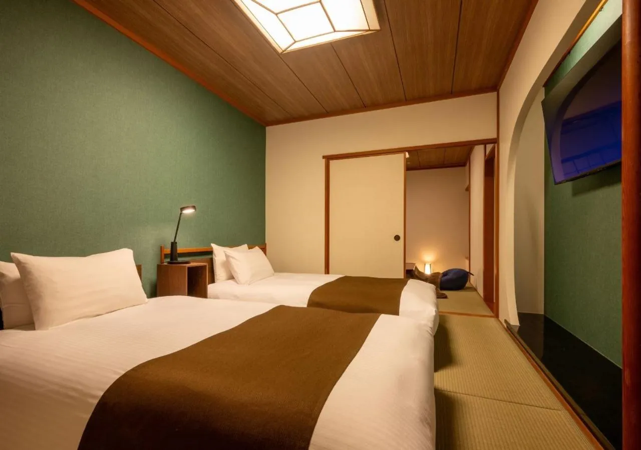 Bed in Marumine Kanko Hotel