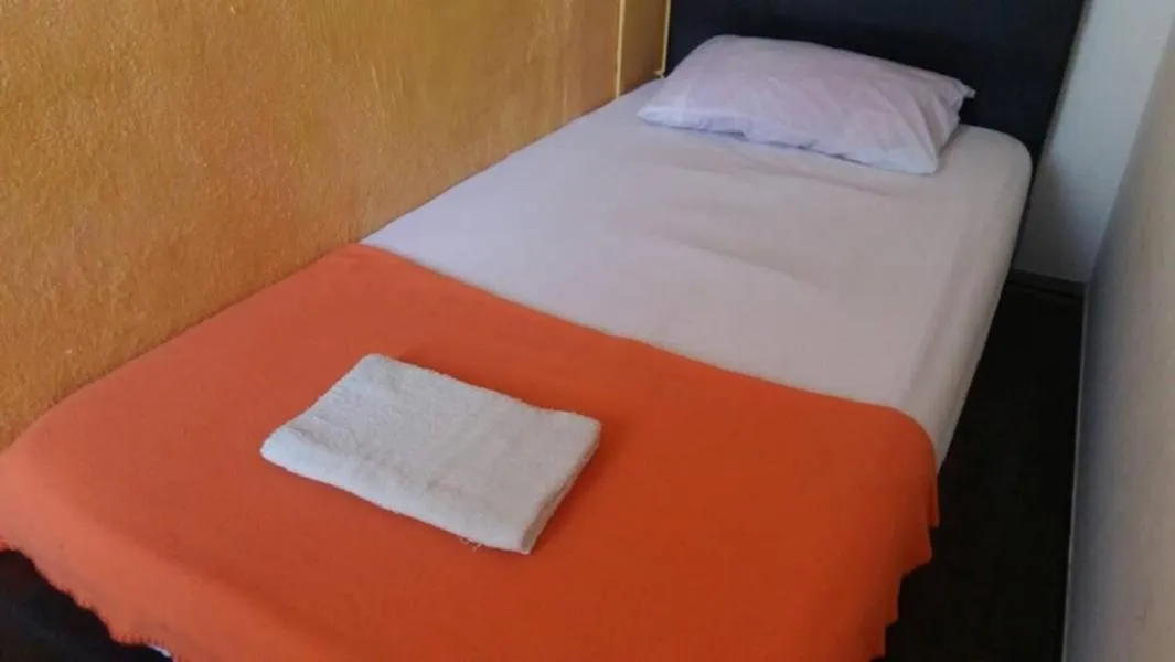 Bed in Cocoa Mews Cafe and Homestay
